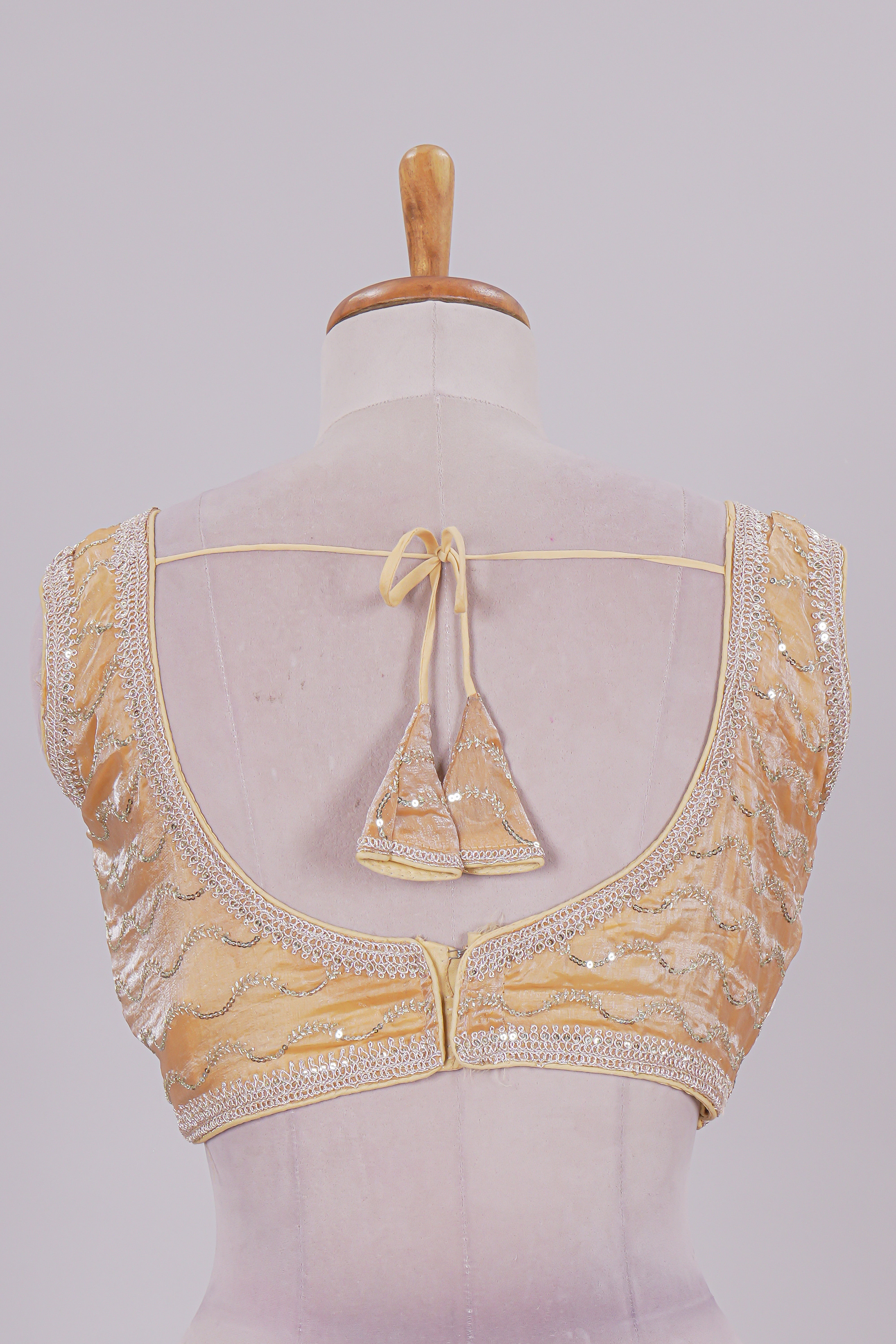 Yellow chamki embroidery work readymade designer blouse, sleeveless V neck with back tassels