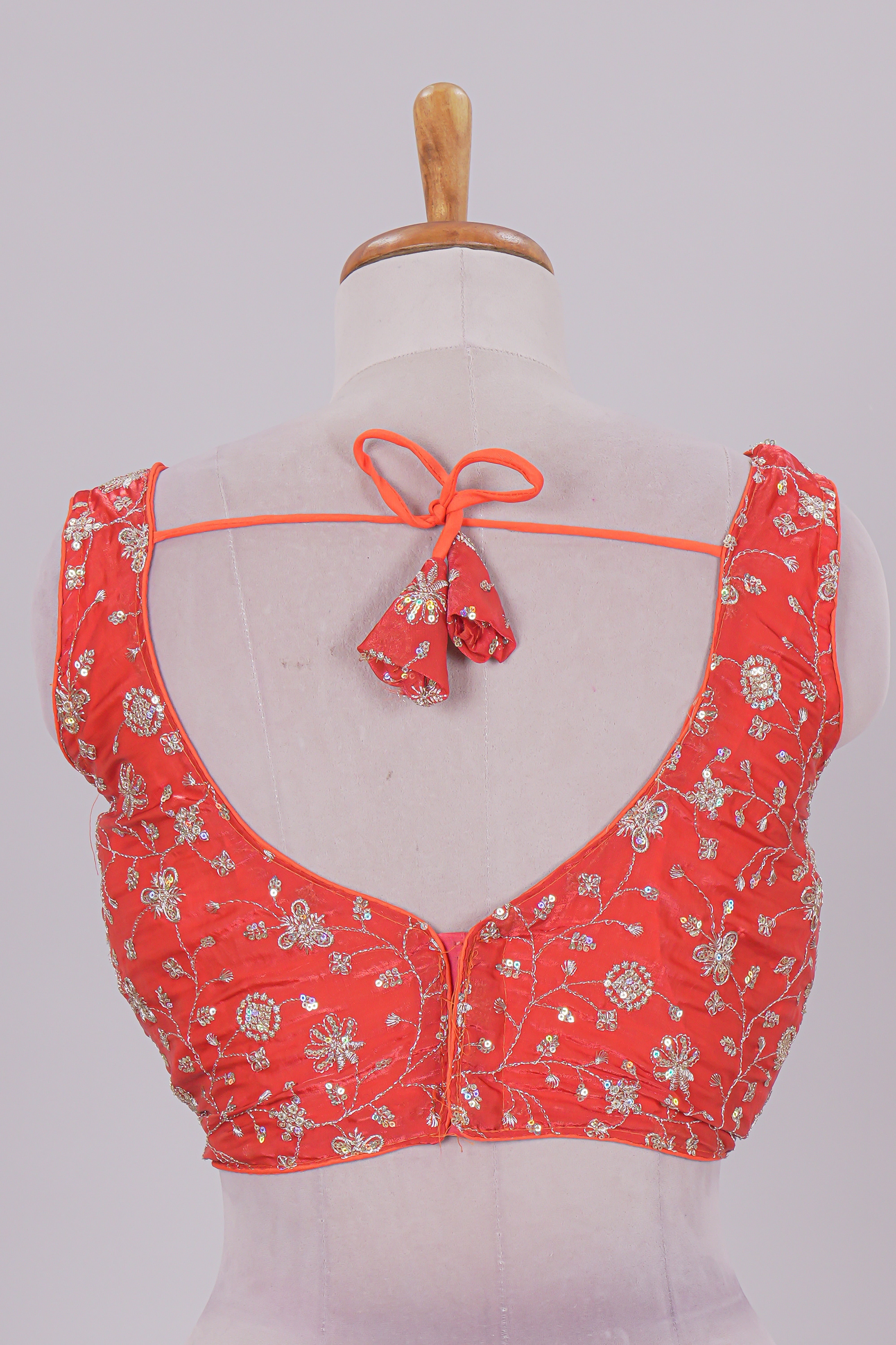 Orange floral chamki embroidery work readymade designer blouse, sleeveless V neck with back tassels