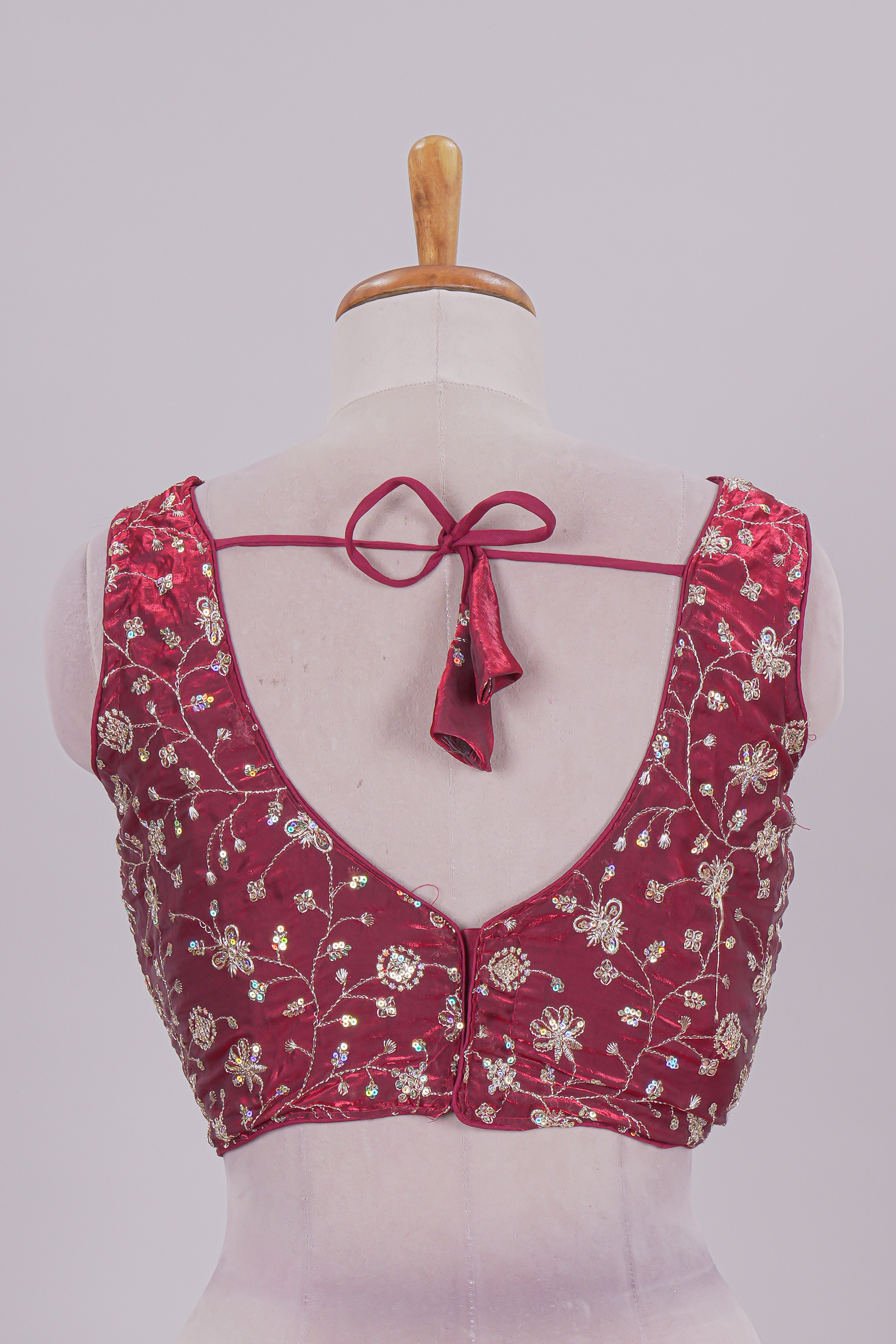 Maroon floral chamki embroidery work readymade designer blouse, sleeveless V neck with back tassels