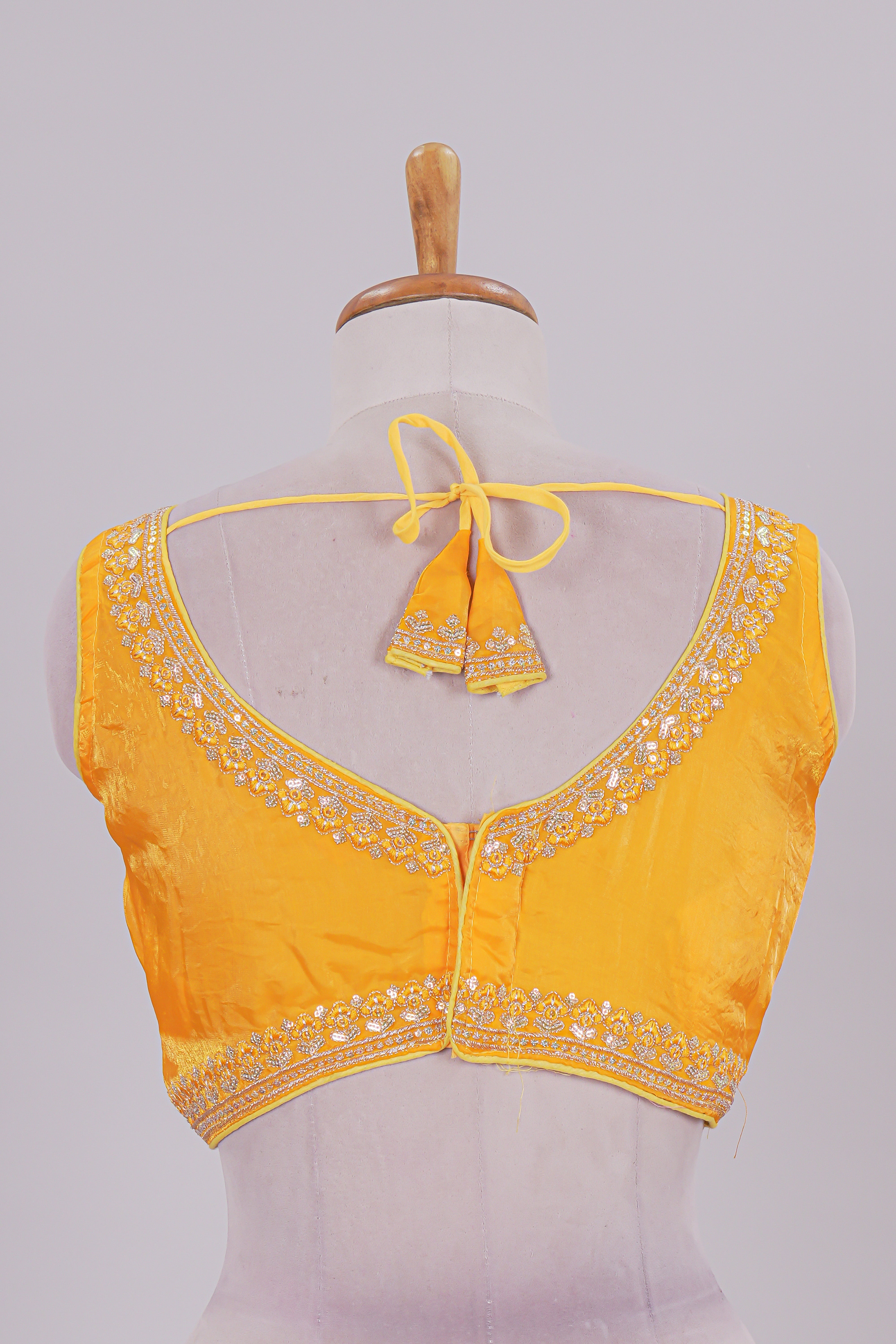 Golden yellow chamki embroidery work readymade designer blouse, sleeveless V neck with back tassels