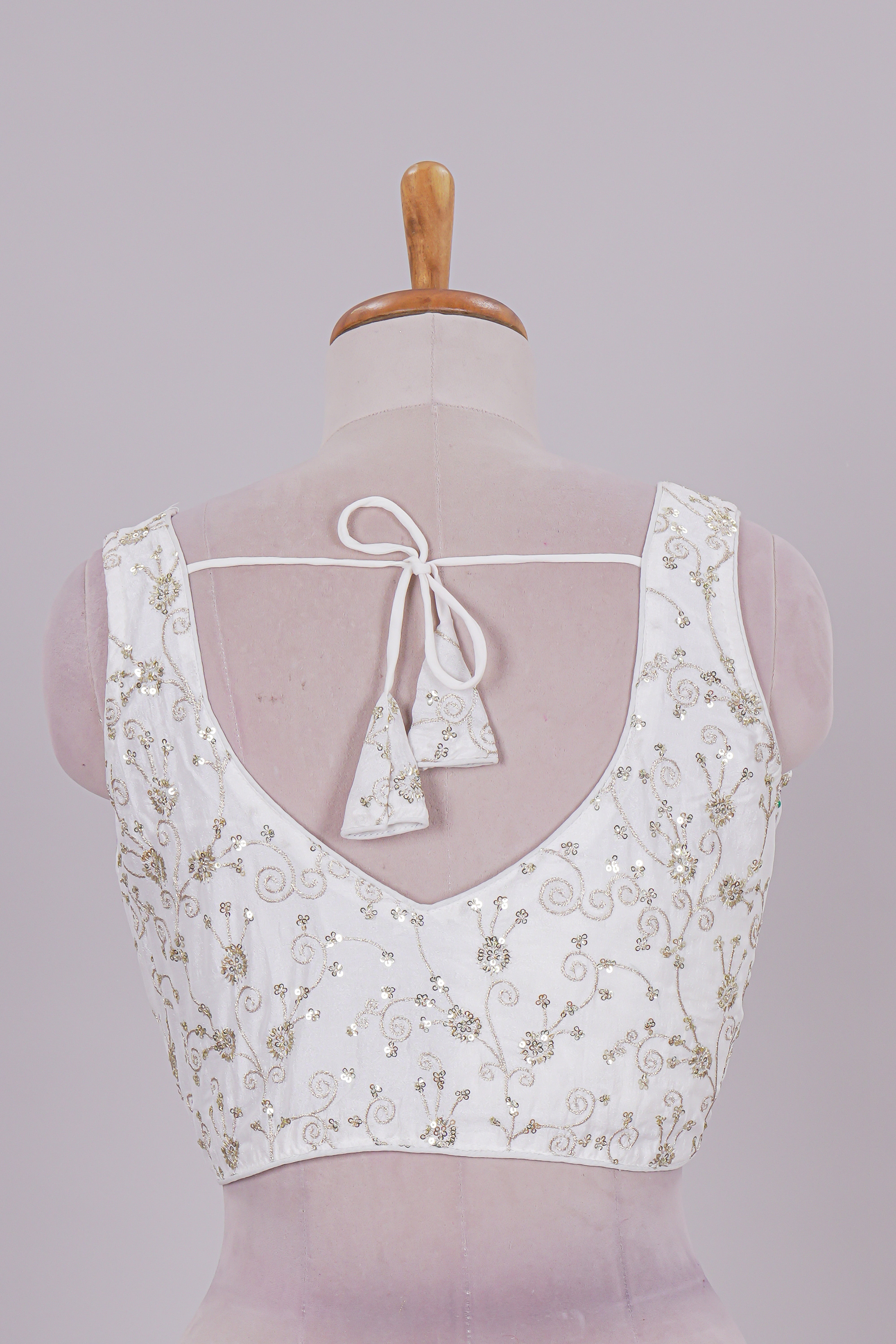 White chamki embroidery work readymade designer blouse, sleeveless V neck with back tassels