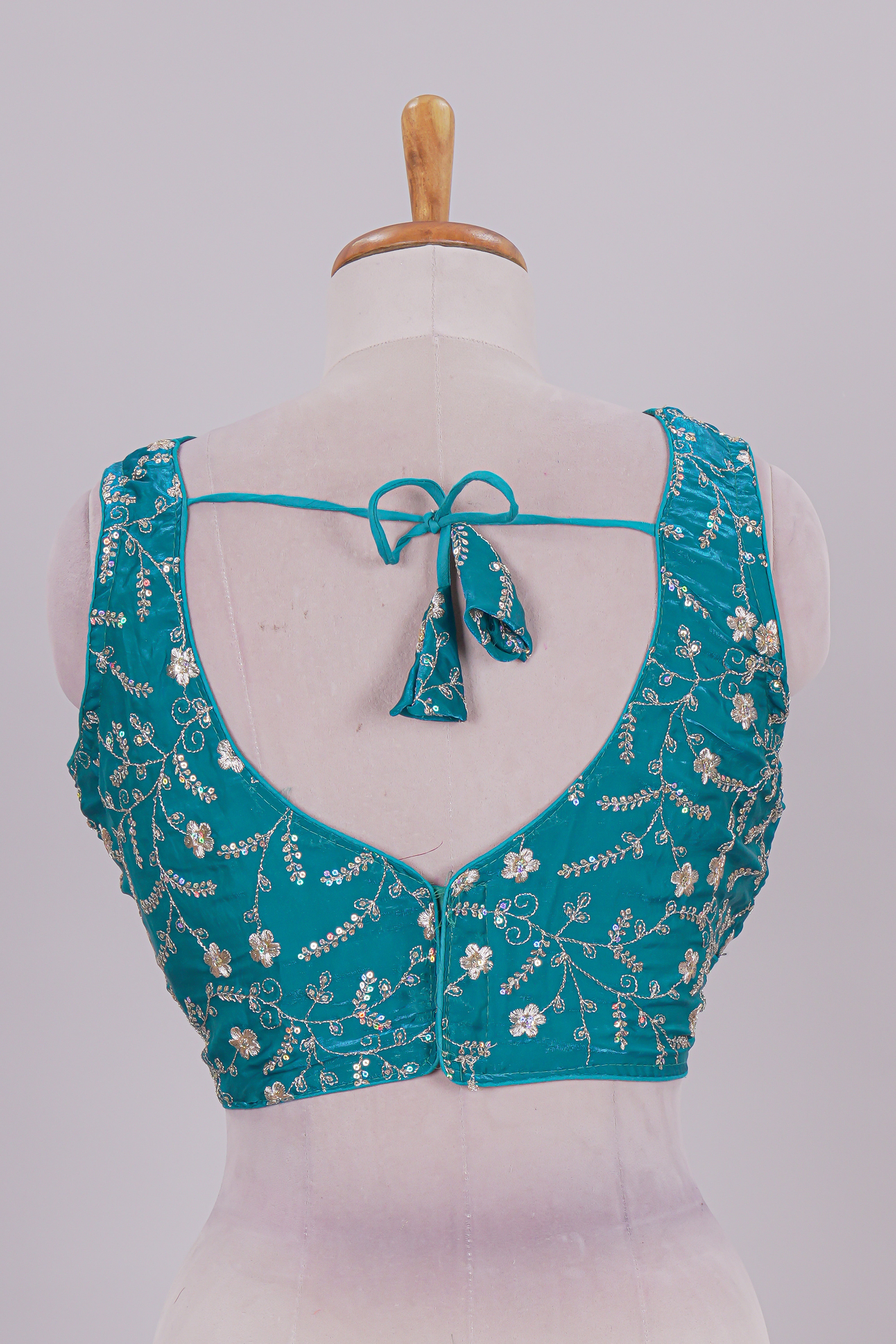 Viridian green floral chamki embroidery work readymade designer blouse, sleeveless V neck with back tassels