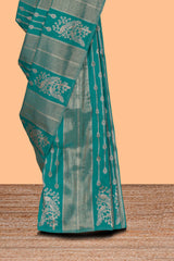 Borderless green striped and peacock zari design raw silk saree with self zari pallu and matching blouse