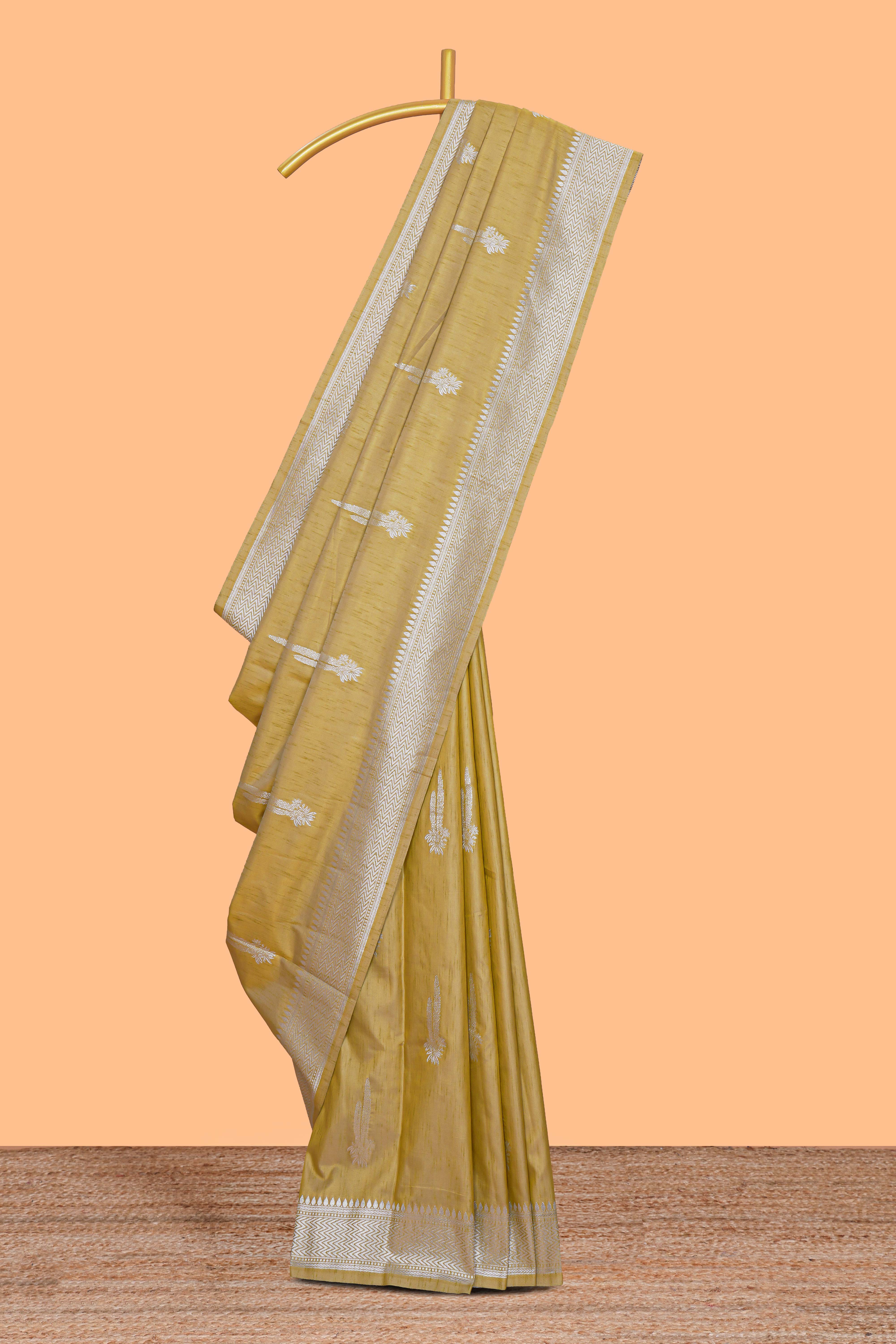 Mustard floral zari motifs design raw silk saree with self zari border and matching motifs blouse