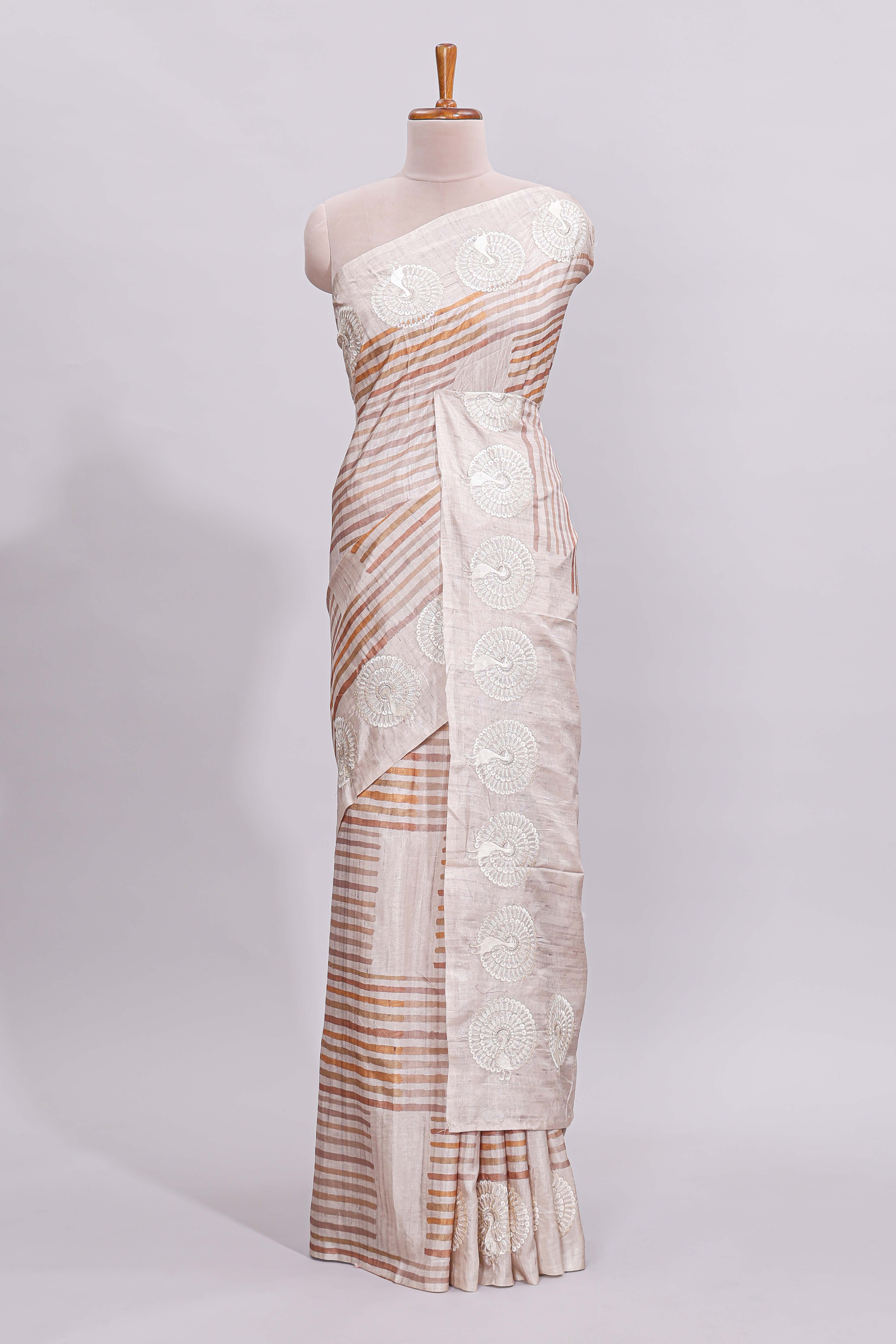 Beige striped design raw silk saree with self border and matching blouse