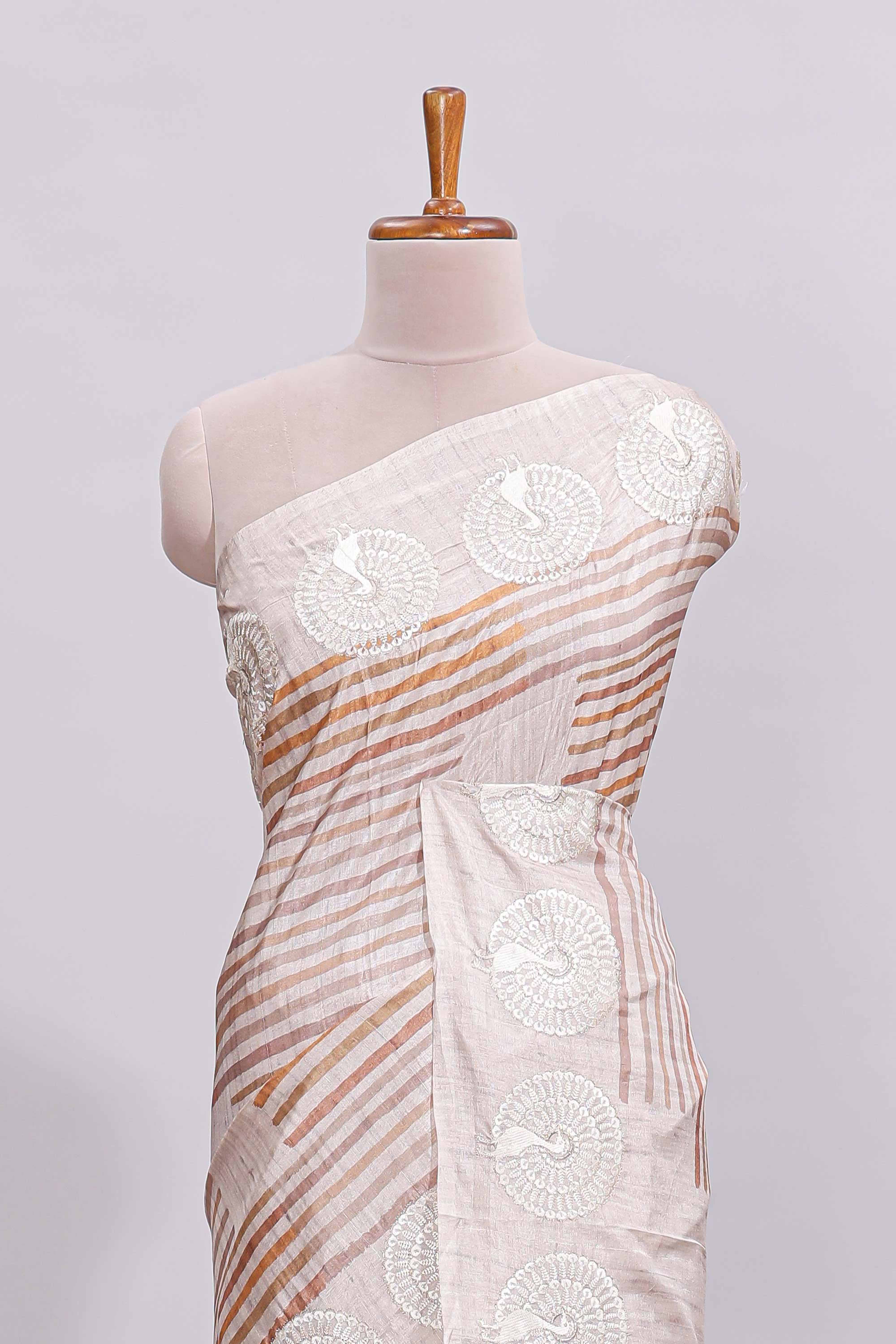 Beige striped design raw silk saree with self border and matching blouse