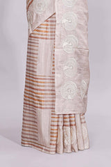 Beige striped design raw silk saree with self border and matching blouse