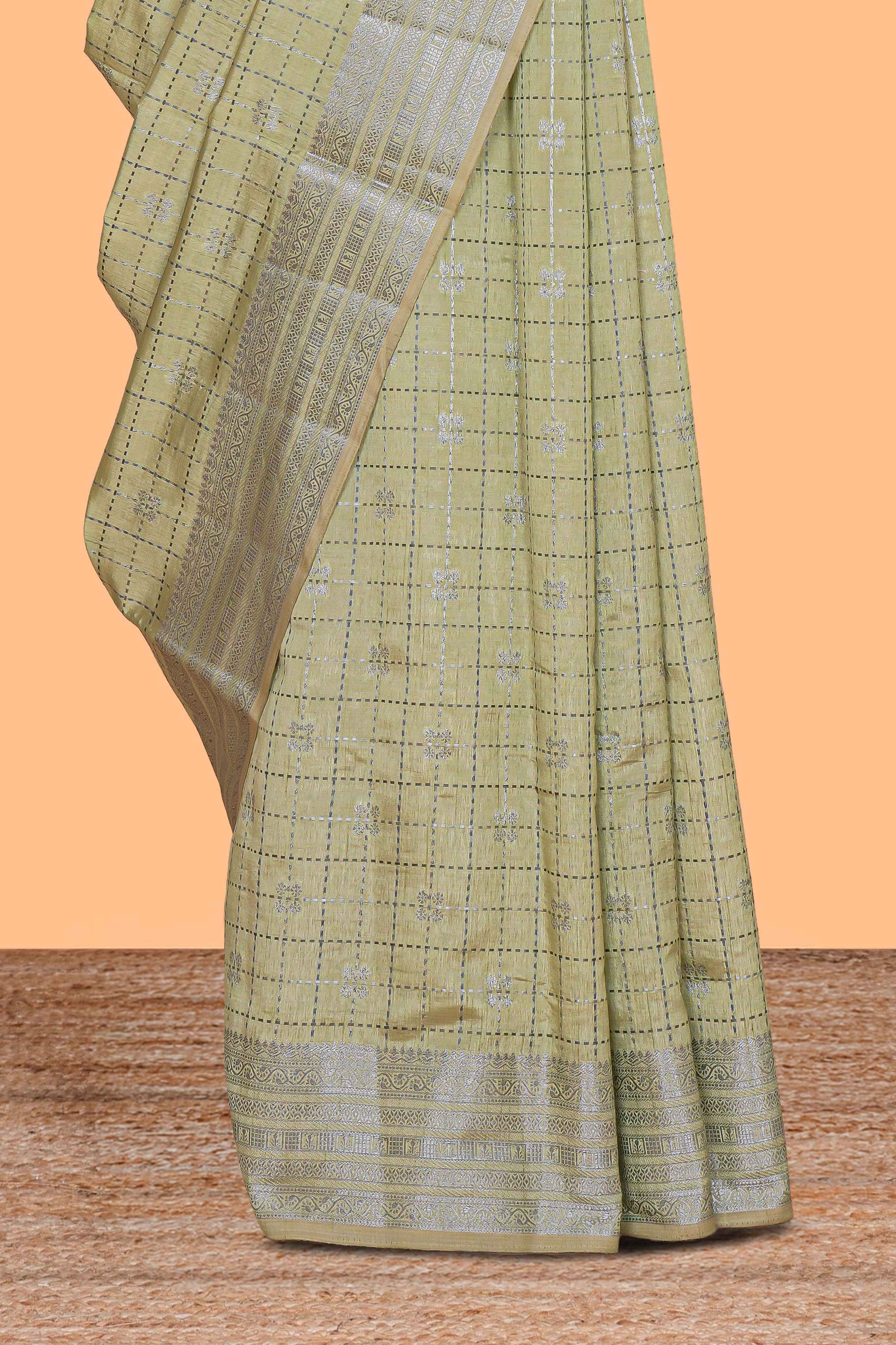 Green checked zari design raw silk saree with self zari border and matching striped blouse