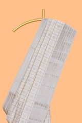 Off white checked zari design raw silk saree with self zari border and matching striped blouse
