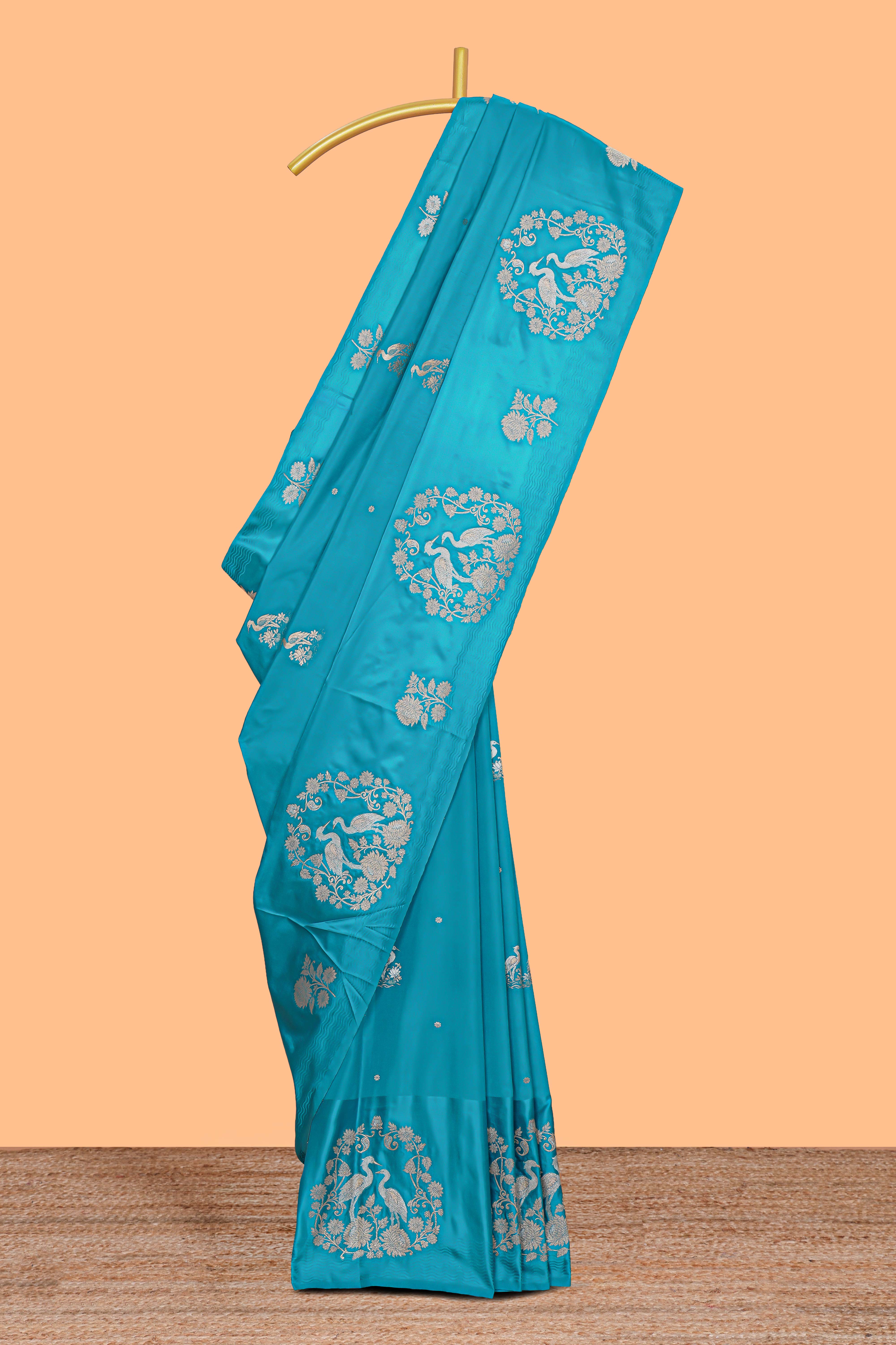 Blue floral zari motifs design raw silk saree with self zari border and matching blouse