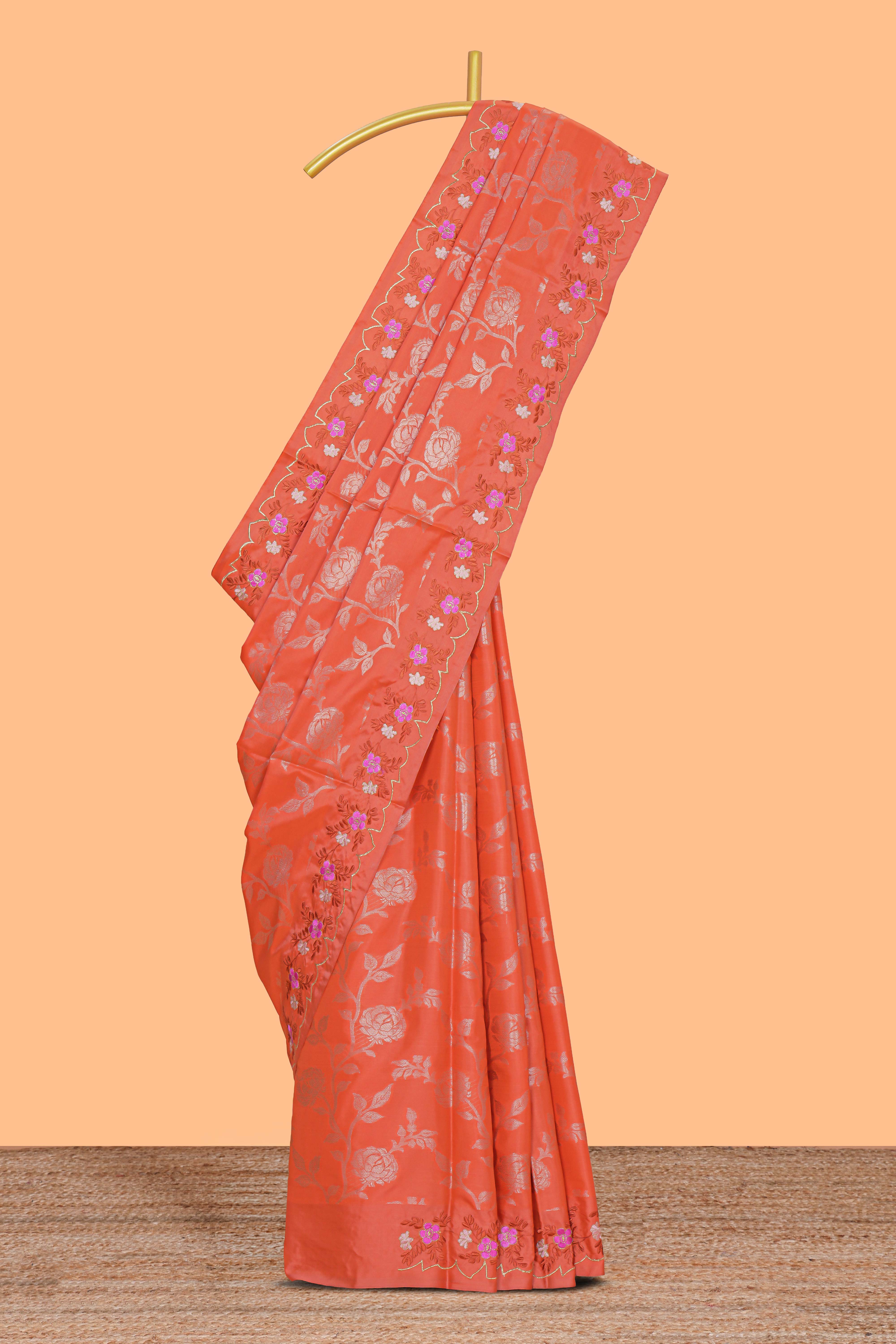 Orange floral zari motifs design raw silk saree with self zari border and matching blouse