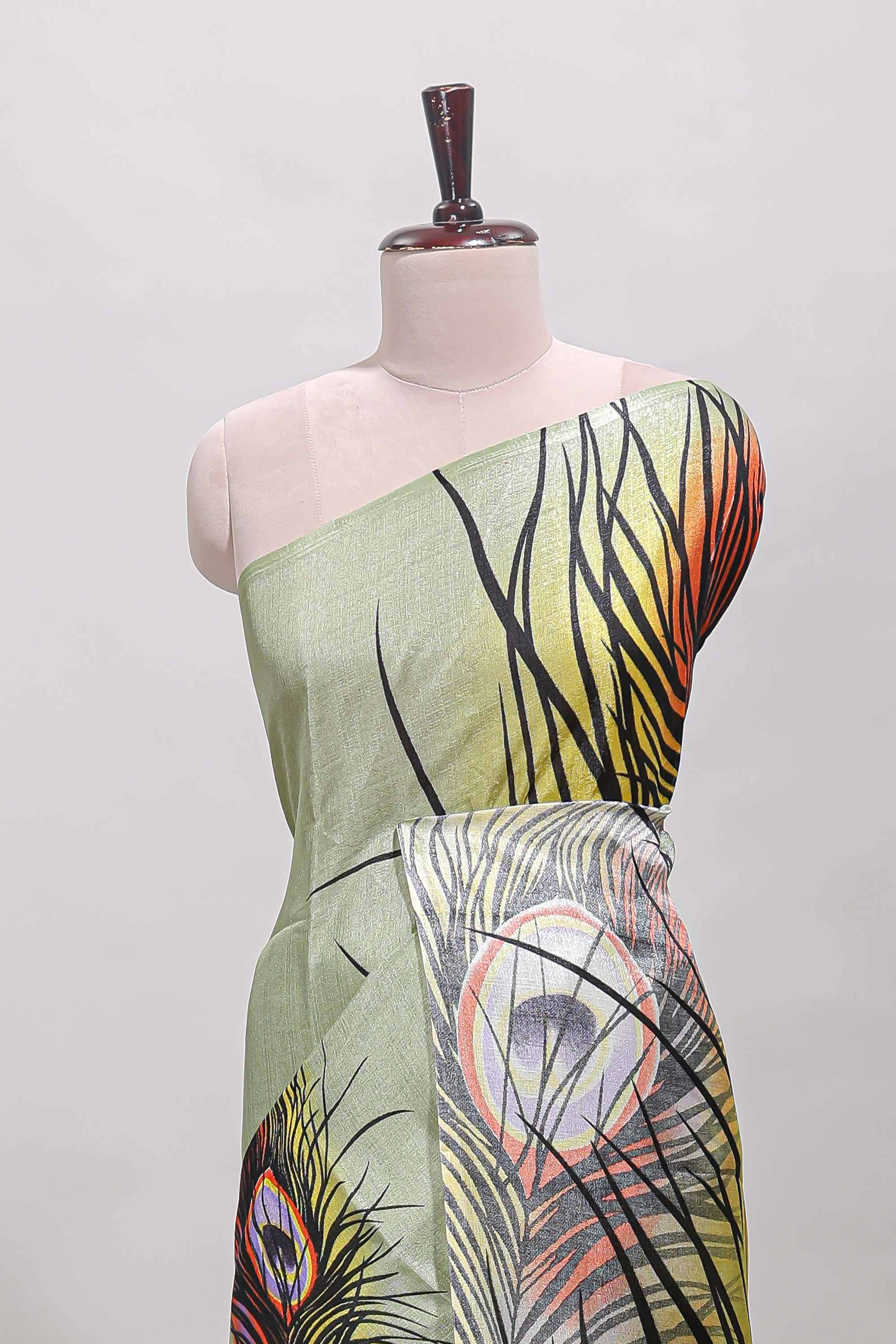 Pastel green peacock feather print south cotton saree with matching blouse