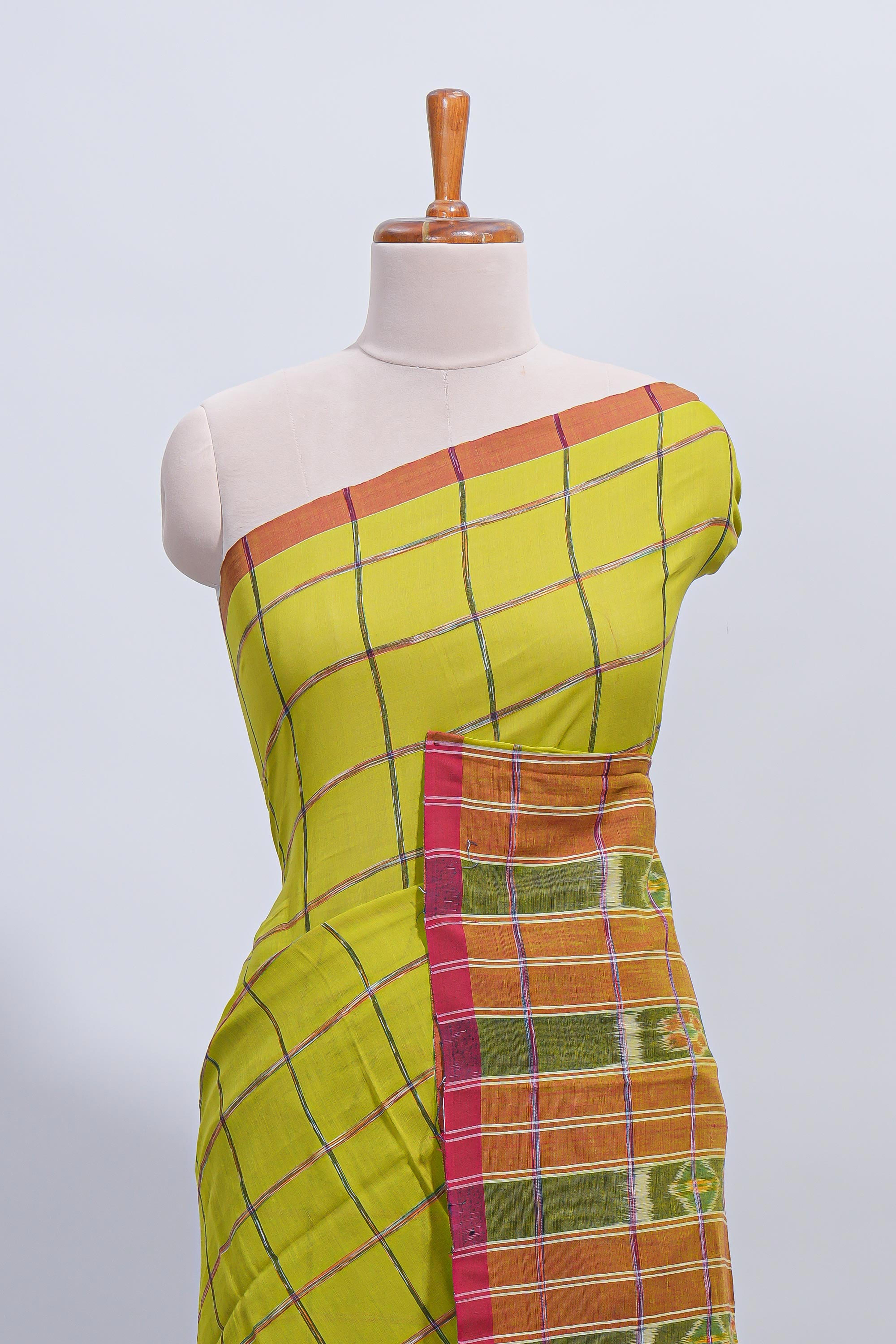 Green checked south cotton saree with contrast border and ikkat style pallu
