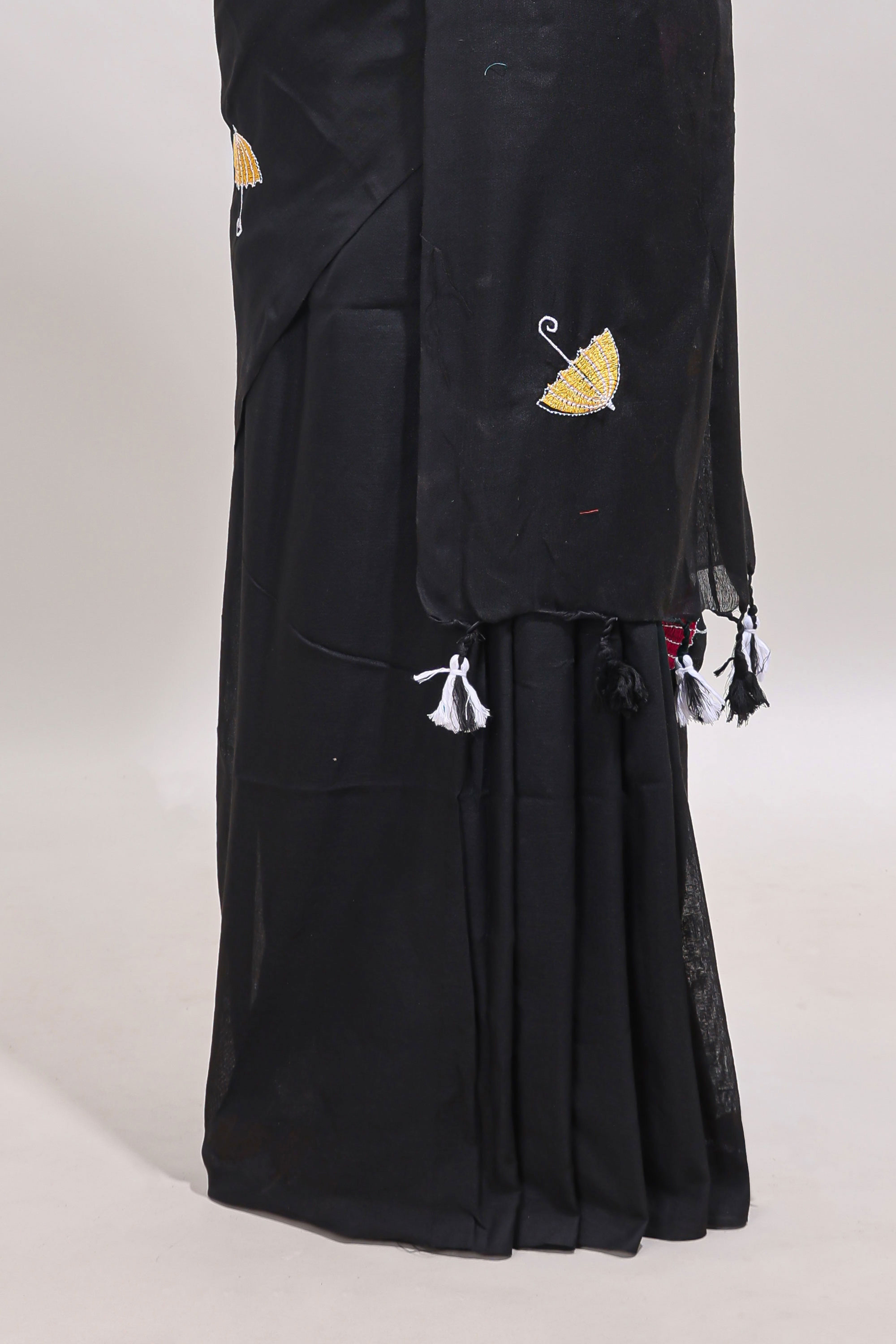 Borderless black umberla motifs design saree with contrast blouse and tassels