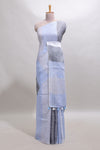 Light sky blue south cotton saree body with broad grey contrast borders and a matching striped pallu finished with tassels with a matching blouse piece