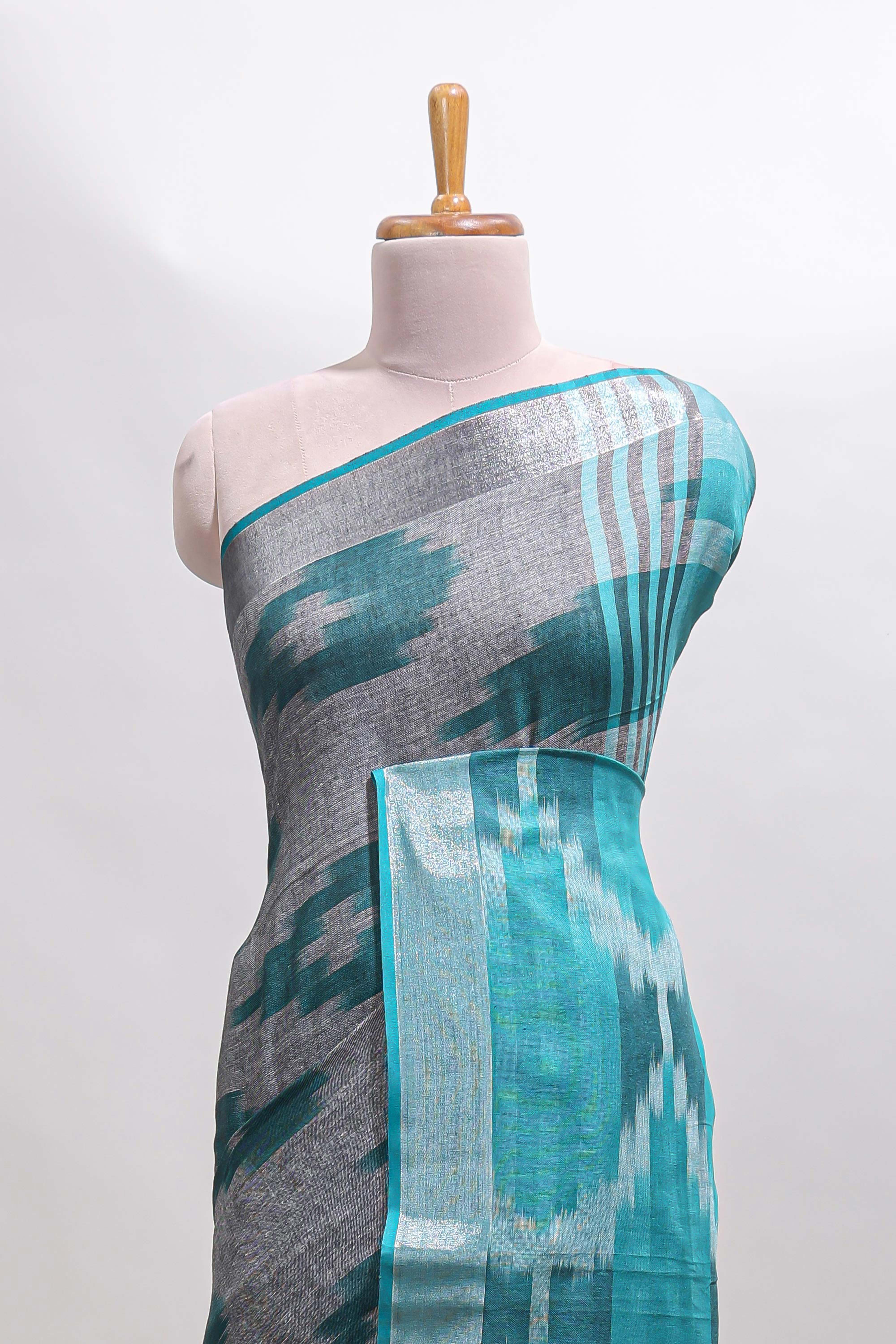 Grey ikkat style motifs south cotton saree with contrast silver zari border and blouse