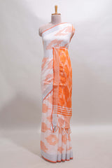 White ikkat style motifs south cotton saree with contrast silver zari border and blouse