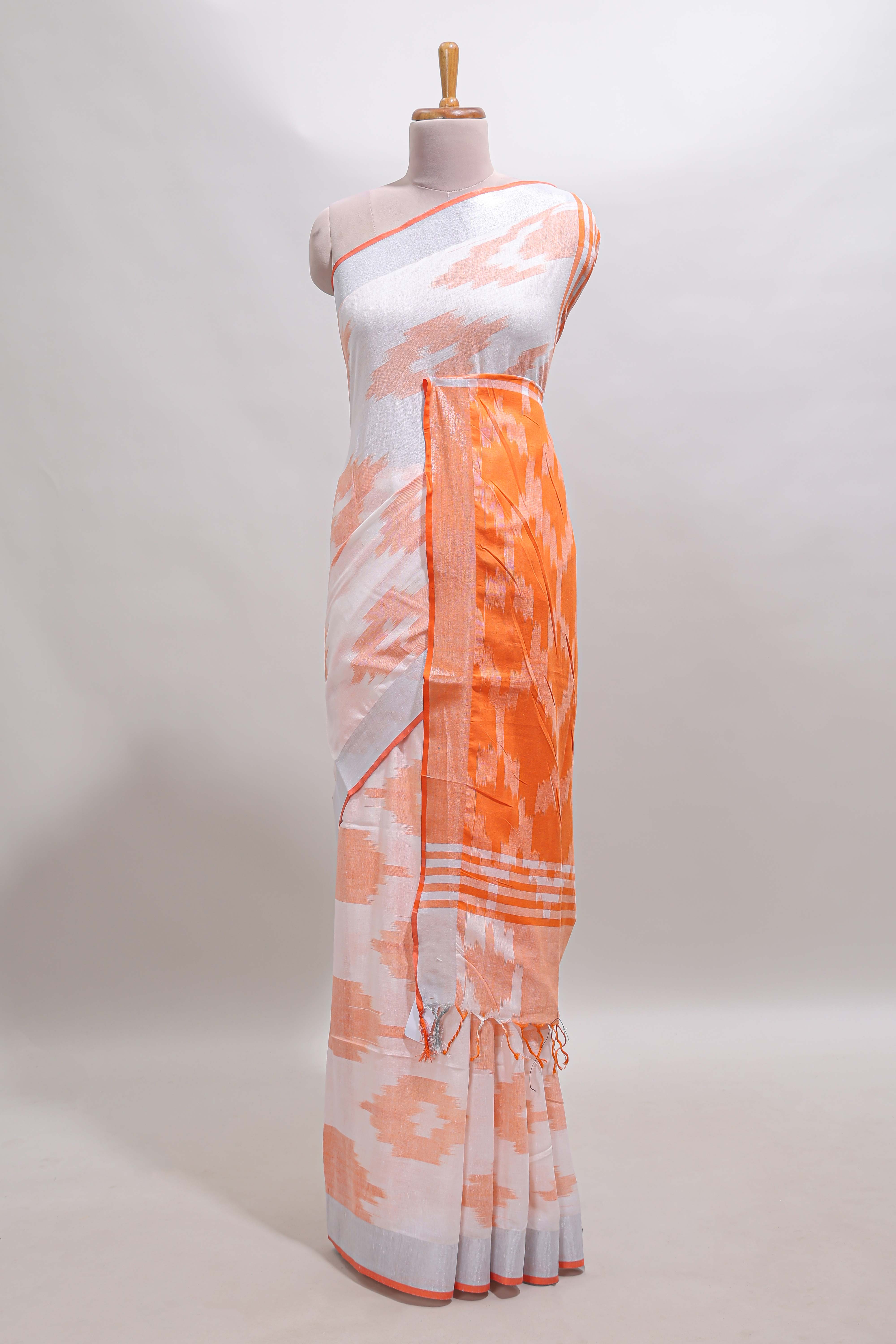 White ikkat style motifs south cotton saree with contrast silver zari border and blouse