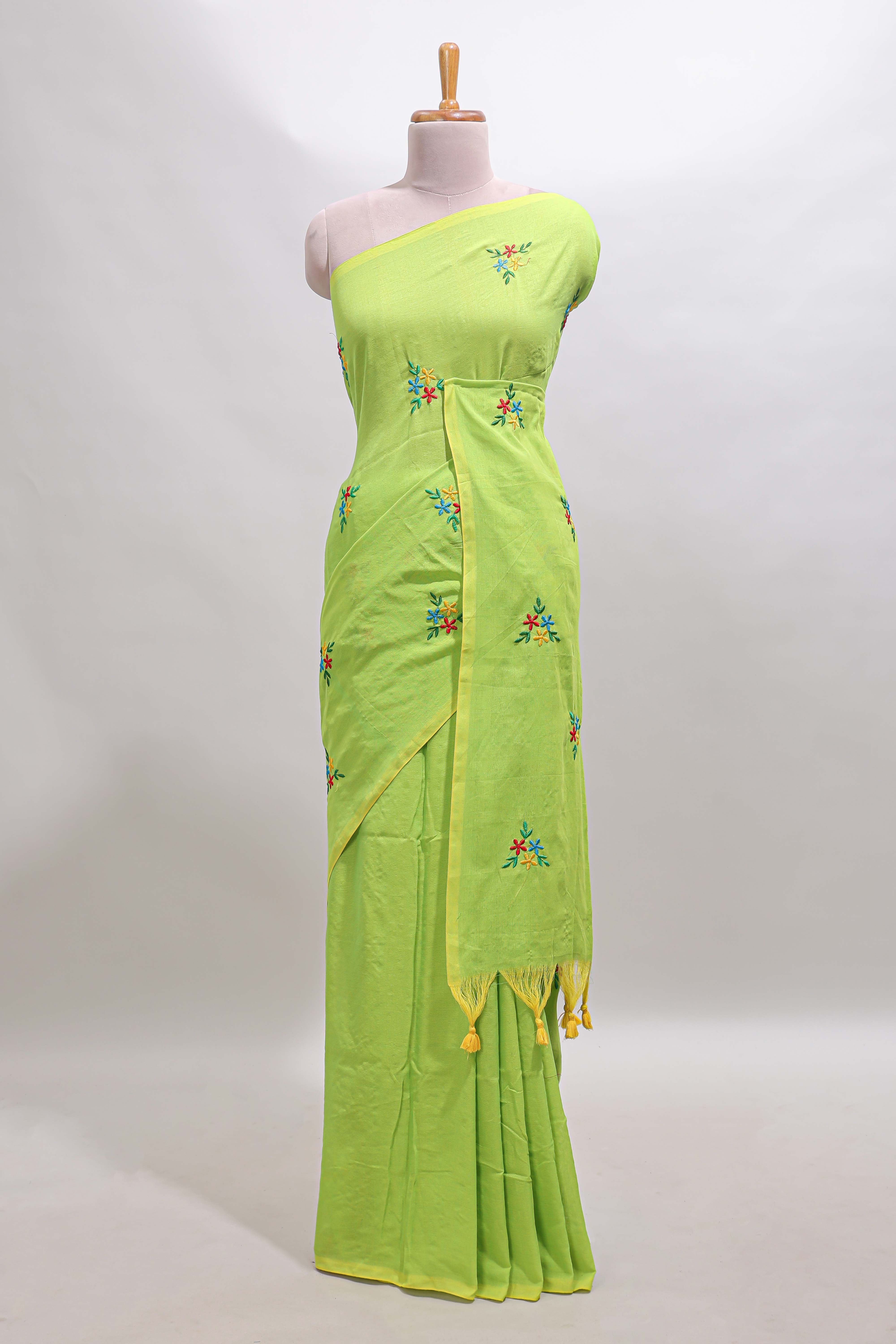 Green floral motifs south cotton sarees with self border and contrast printed blouse