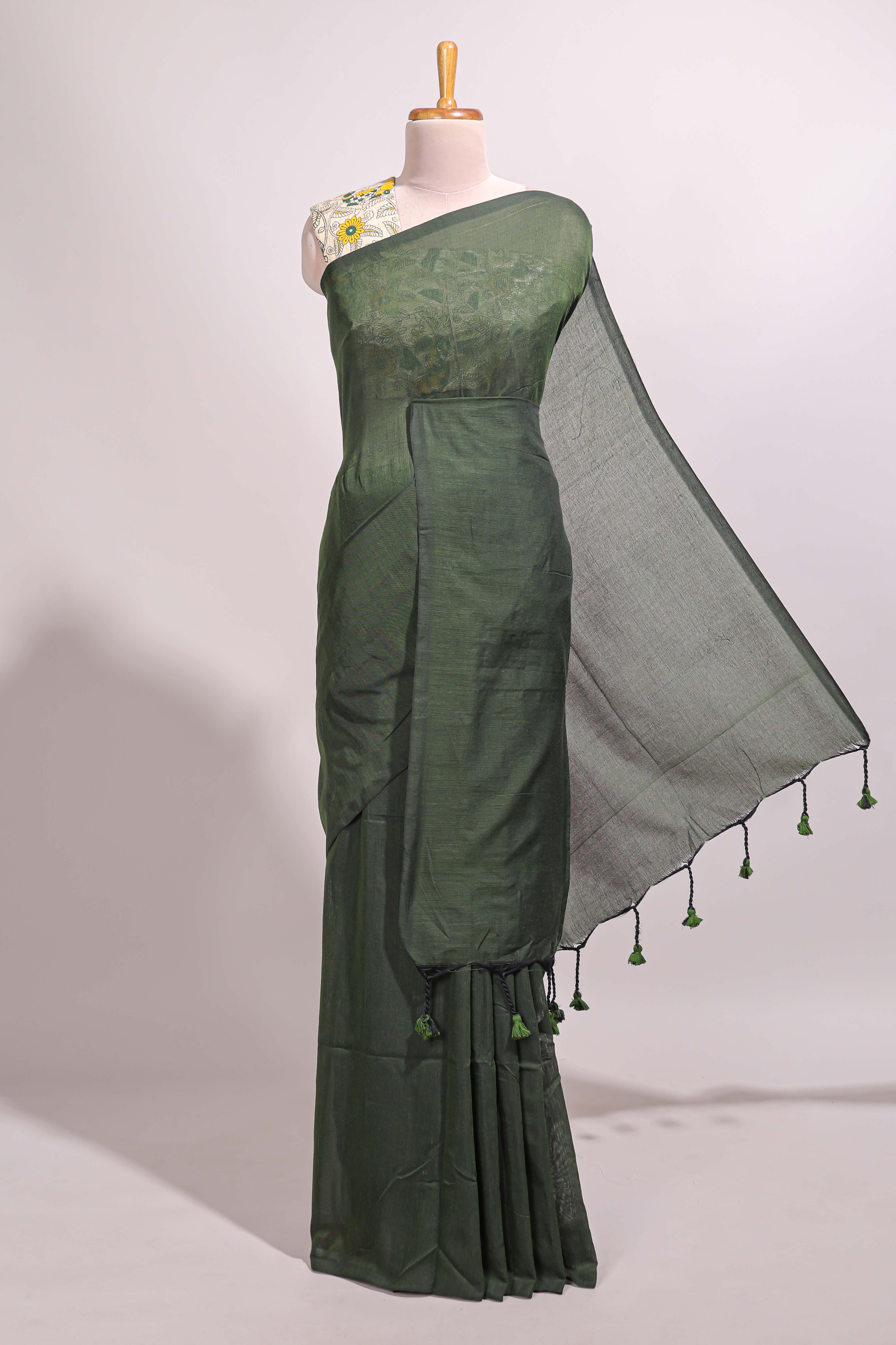 Deep green plain south cotton sarees with contrast floral printed blouse