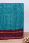 Turquiose blue tamil script print sungudi cotton saree with contrast zari bentex border and pallu