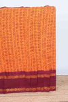 Orange tamil script print sungudi cotton saree with contrast zari bentex border and pallu