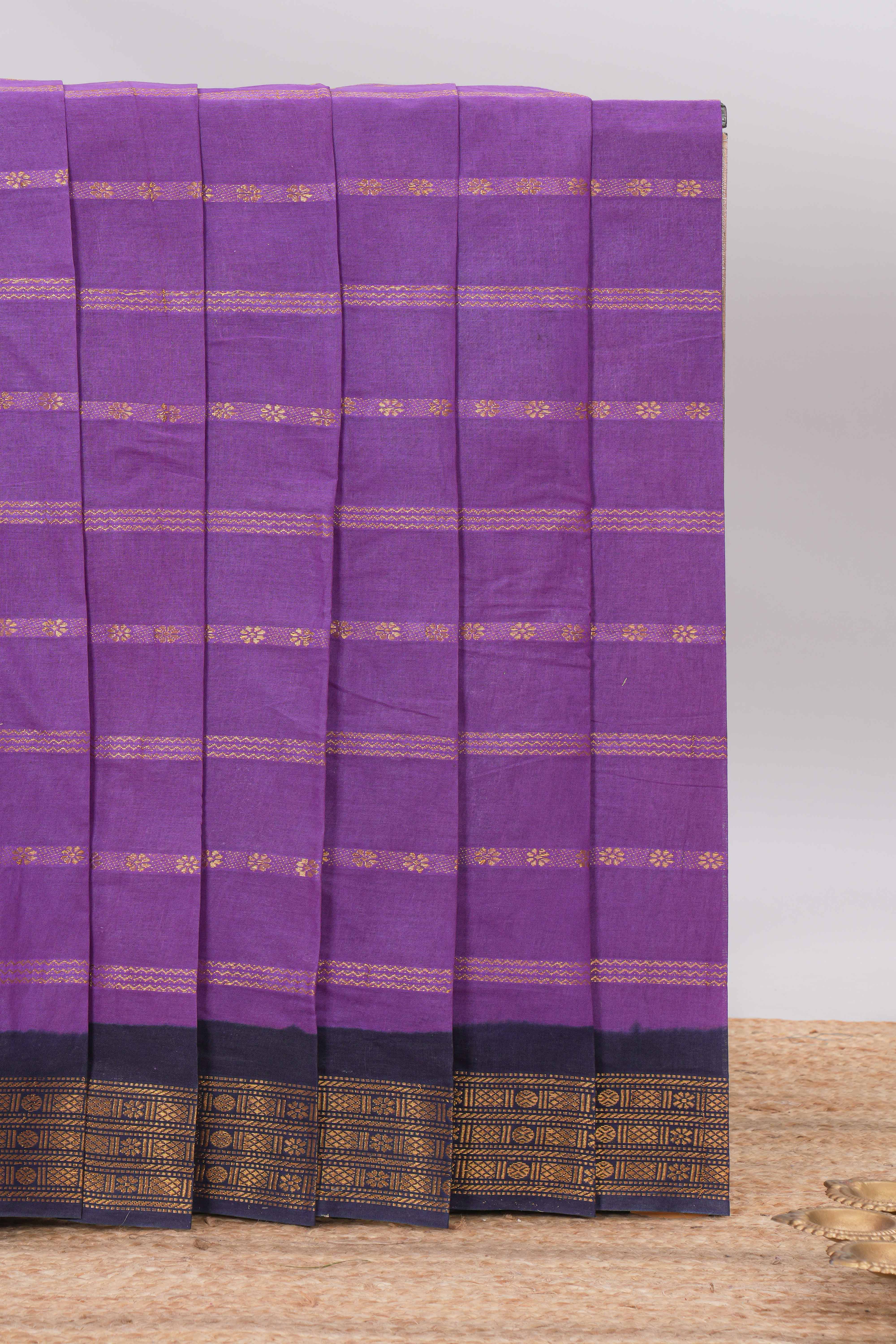 Purple Sungudi cotton saree with gold zari stripe motifs a contrastingzari border checked pallu and contrast blouse