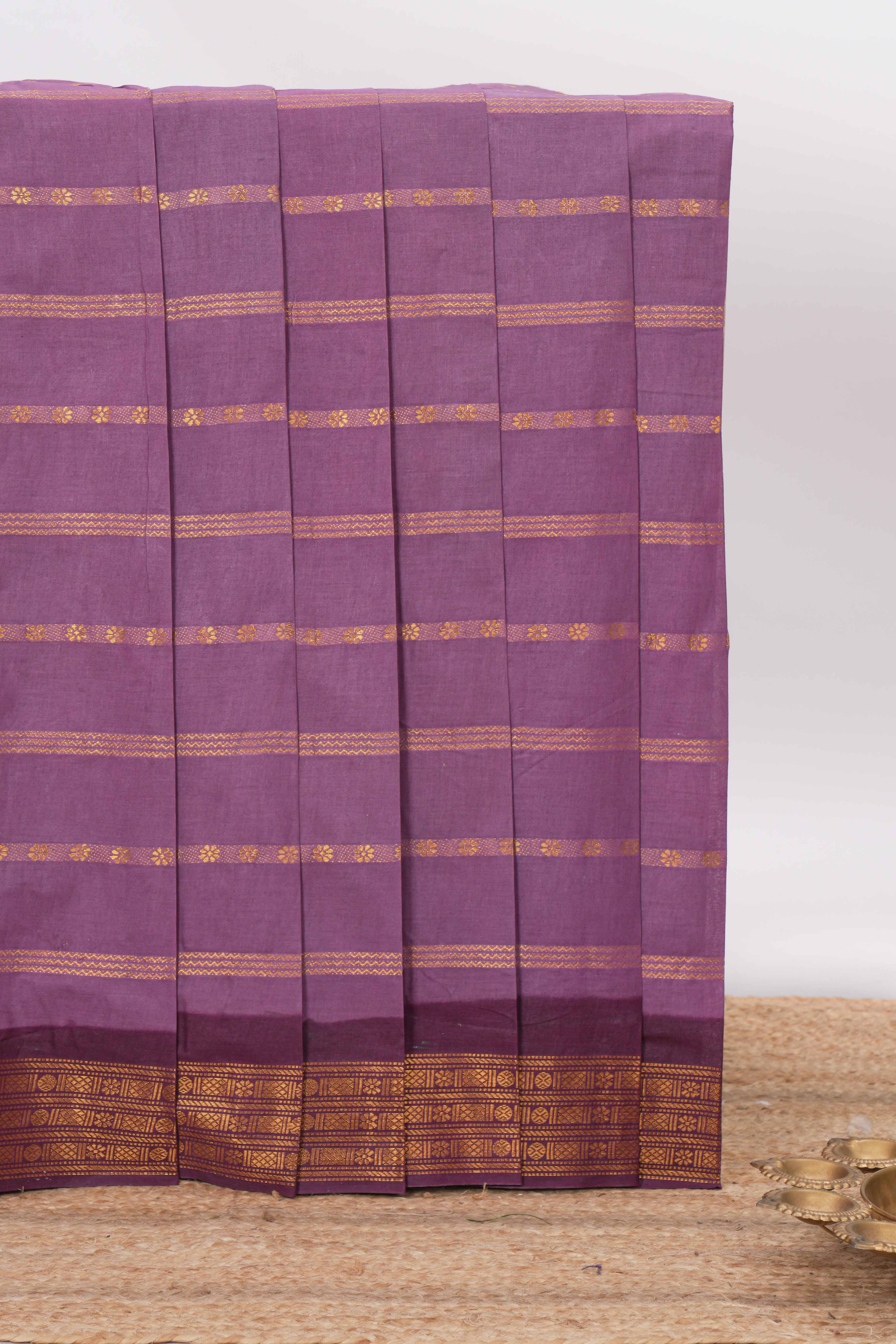Violet Sungudi cotton saree with gold zari stripe motifs a contrastingzari border checked pallu and contrast blouse