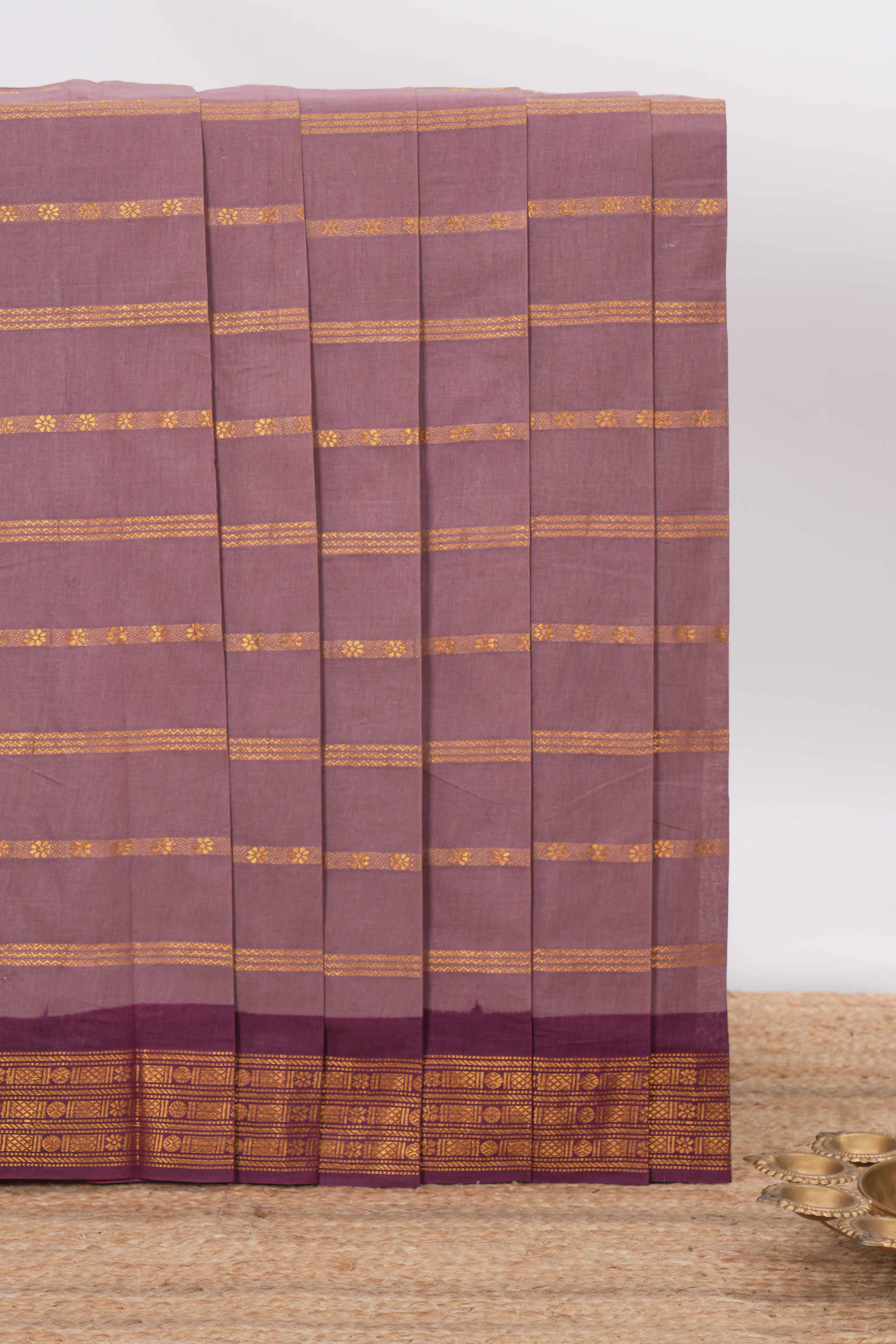 Dark peach Sungudi cotton saree with gold zari stripe motifs a contrastingzari border checked pallu and contrast blouse