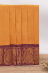 Mustard yellow Chettinad cotton saree with checked body contrastingpeacock zari border striped pallu and a matching checked blouse
