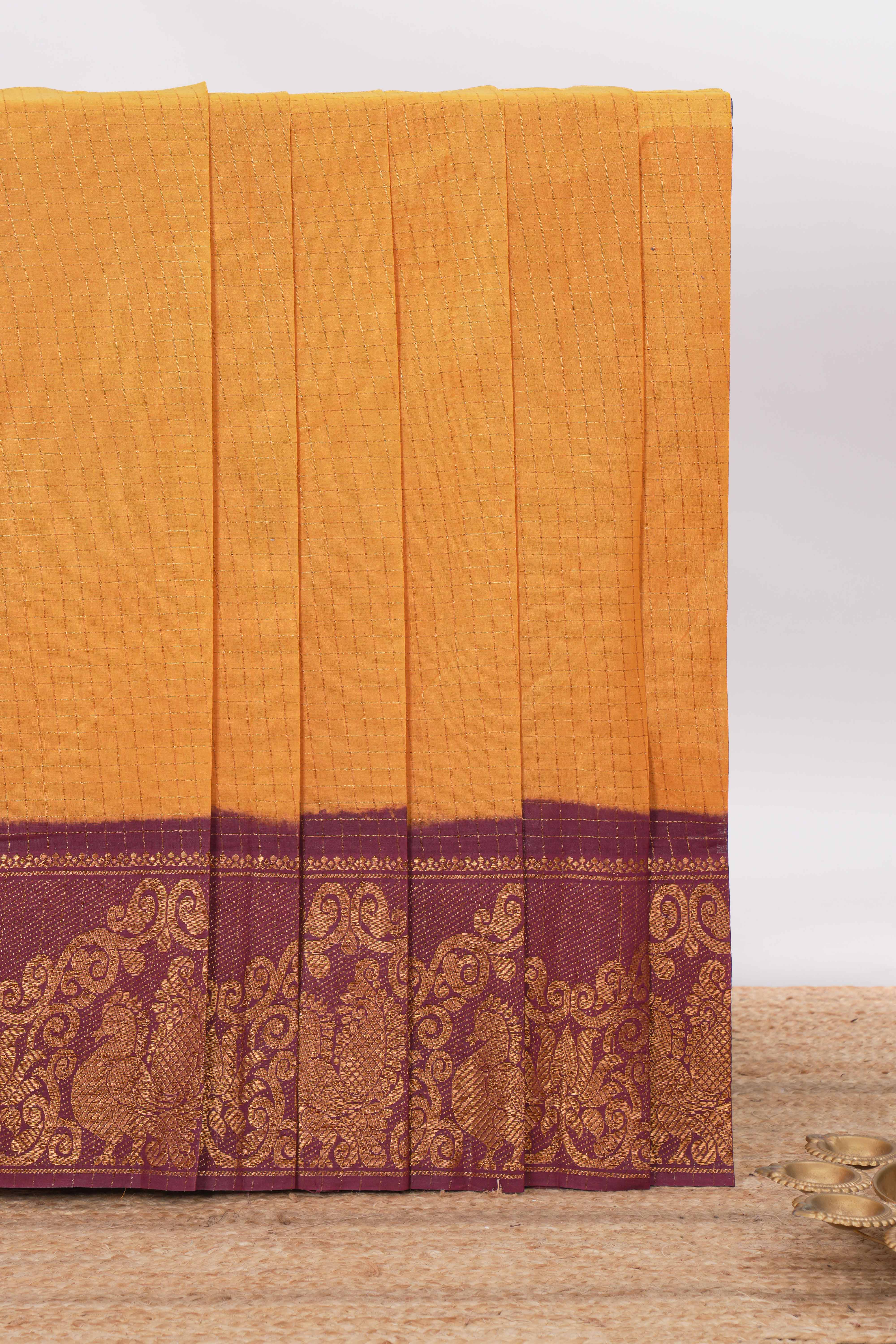 Deep Mustard yellow Chettinad cotton saree with checked body contrasting peacock zari border striped pallu and a matching checked blouse