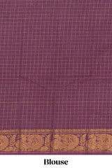 Pink Chettinad cotton saree with checked body contrasting peacock zari border striped pallu and a matching checked blouse