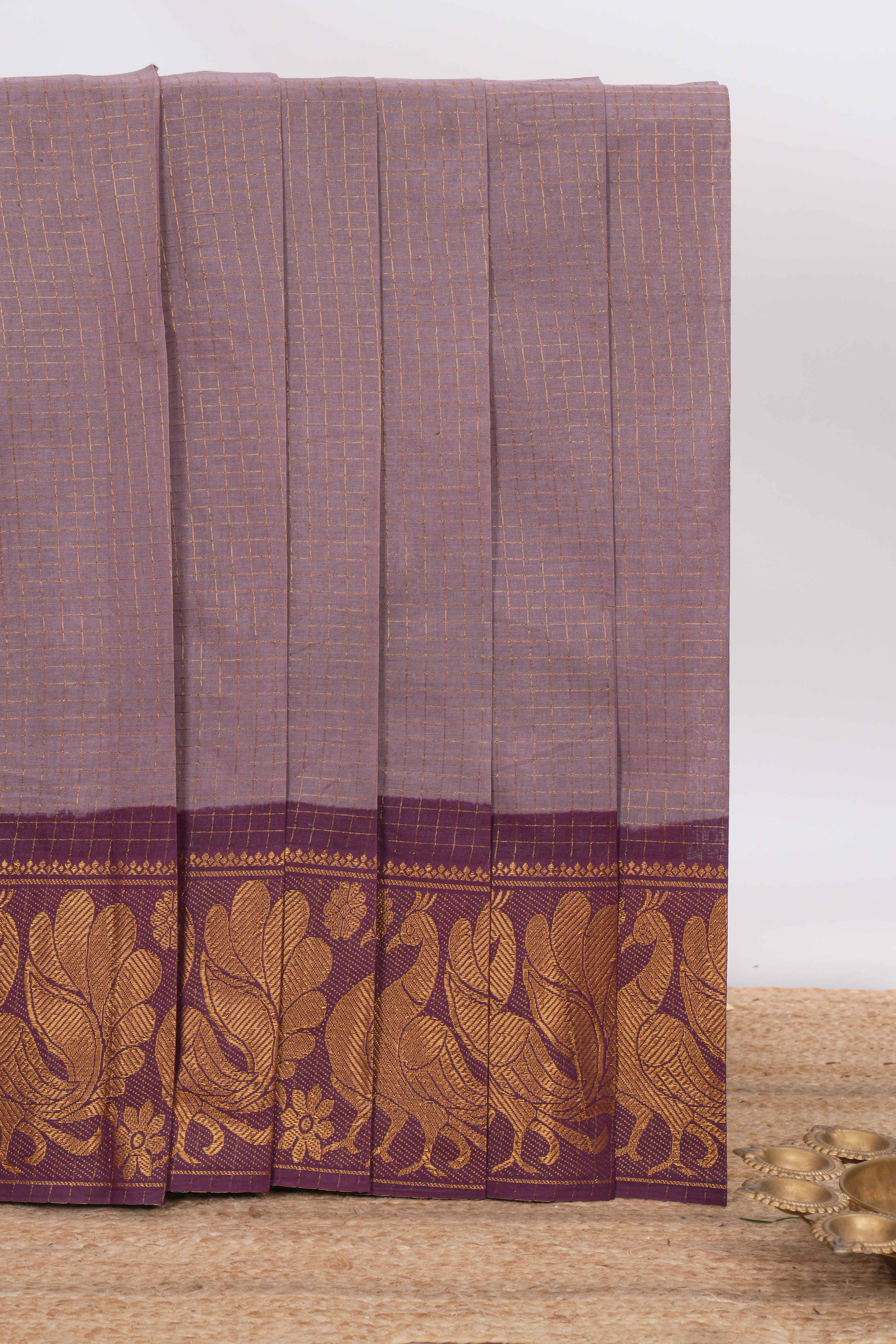Muted Lavender Chettinad cotton saree with checked body contrasting peacock zari border striped pallu and blouse