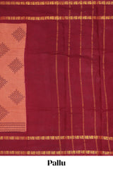 Peach traditional kolam print sungudi cotton saree with contrast border and striped pallu