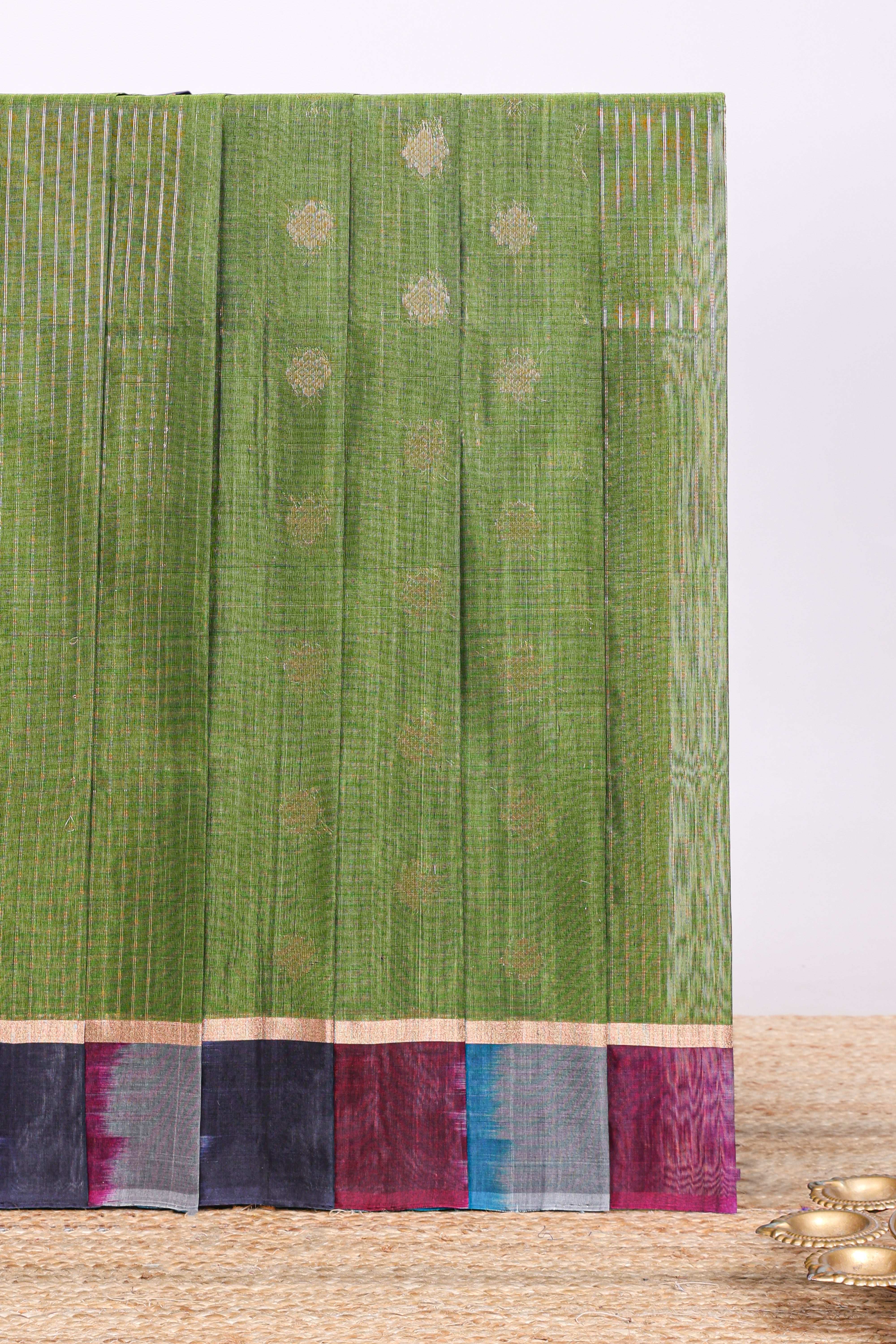 Green striped zari motifs design silk cotton saree with contrast zari border and blouse