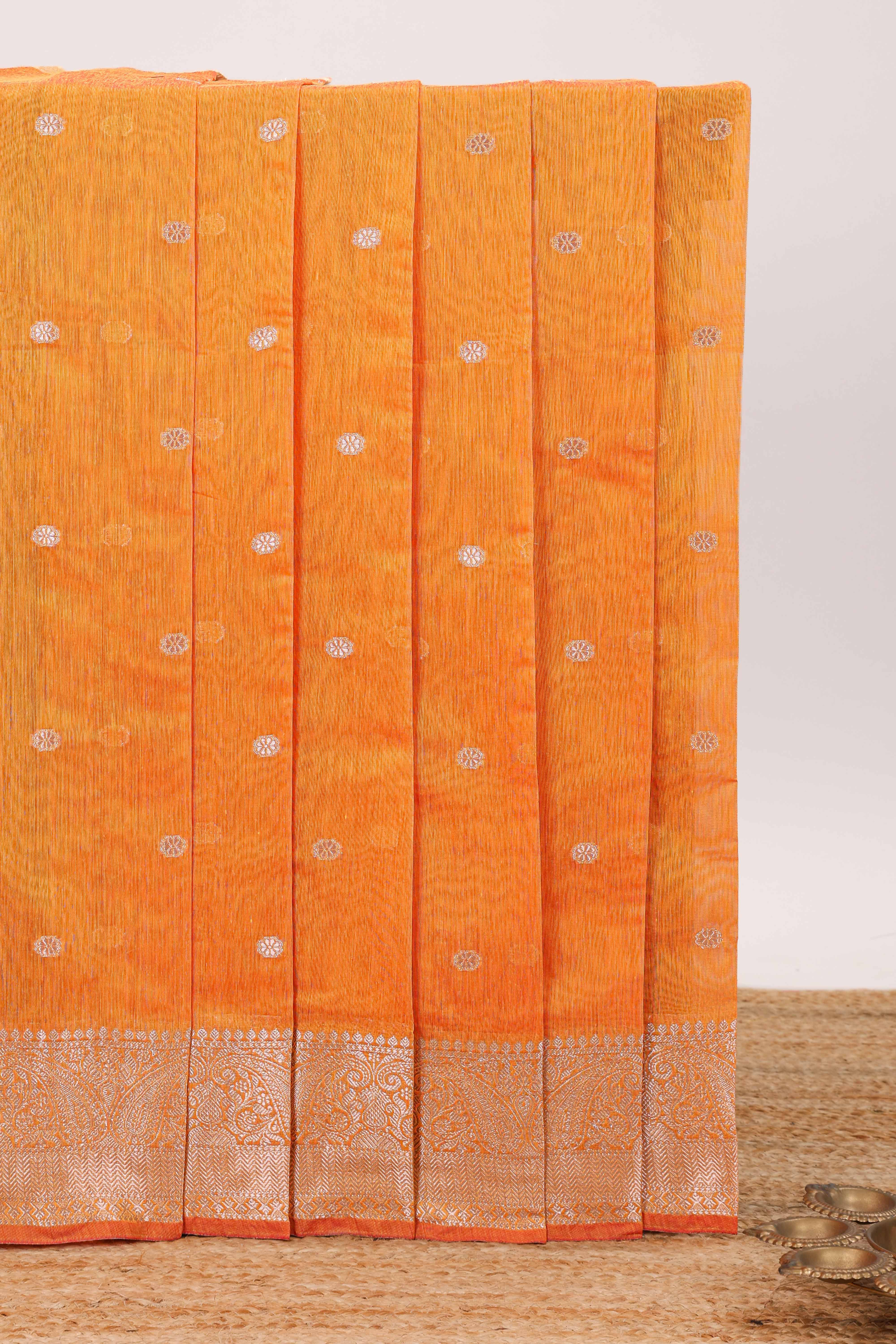Bright orange butta designed silk cotton saree with self zari border and blouse