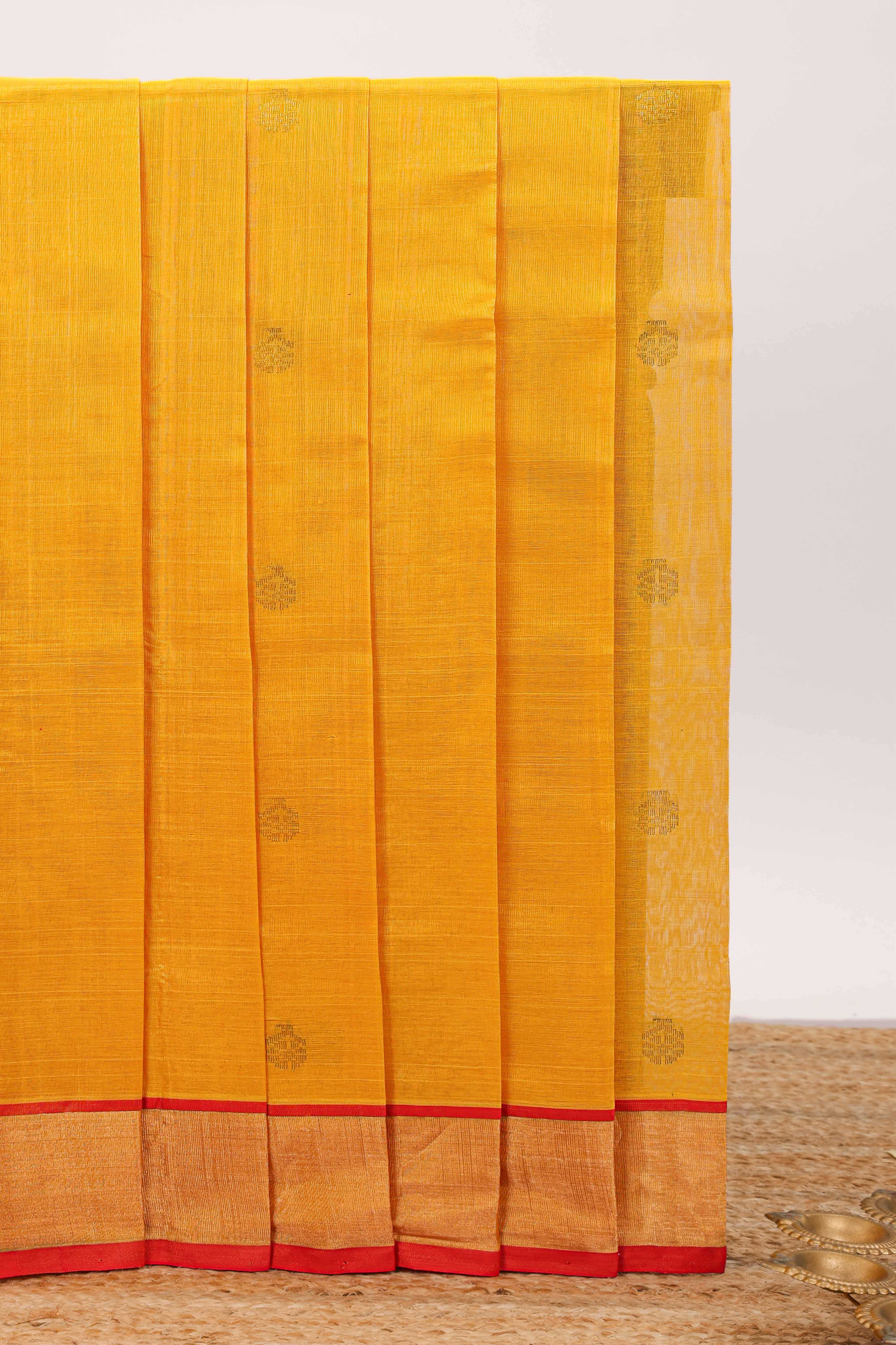 Yellow butta designed silk cotton saree with contrast zari border and blouse