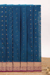 Blue butta designed silk cotton saree with contrast zari border and contrast blouse