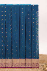 Blue butta designed silk cotton saree with contrast zari border and contrast blouse