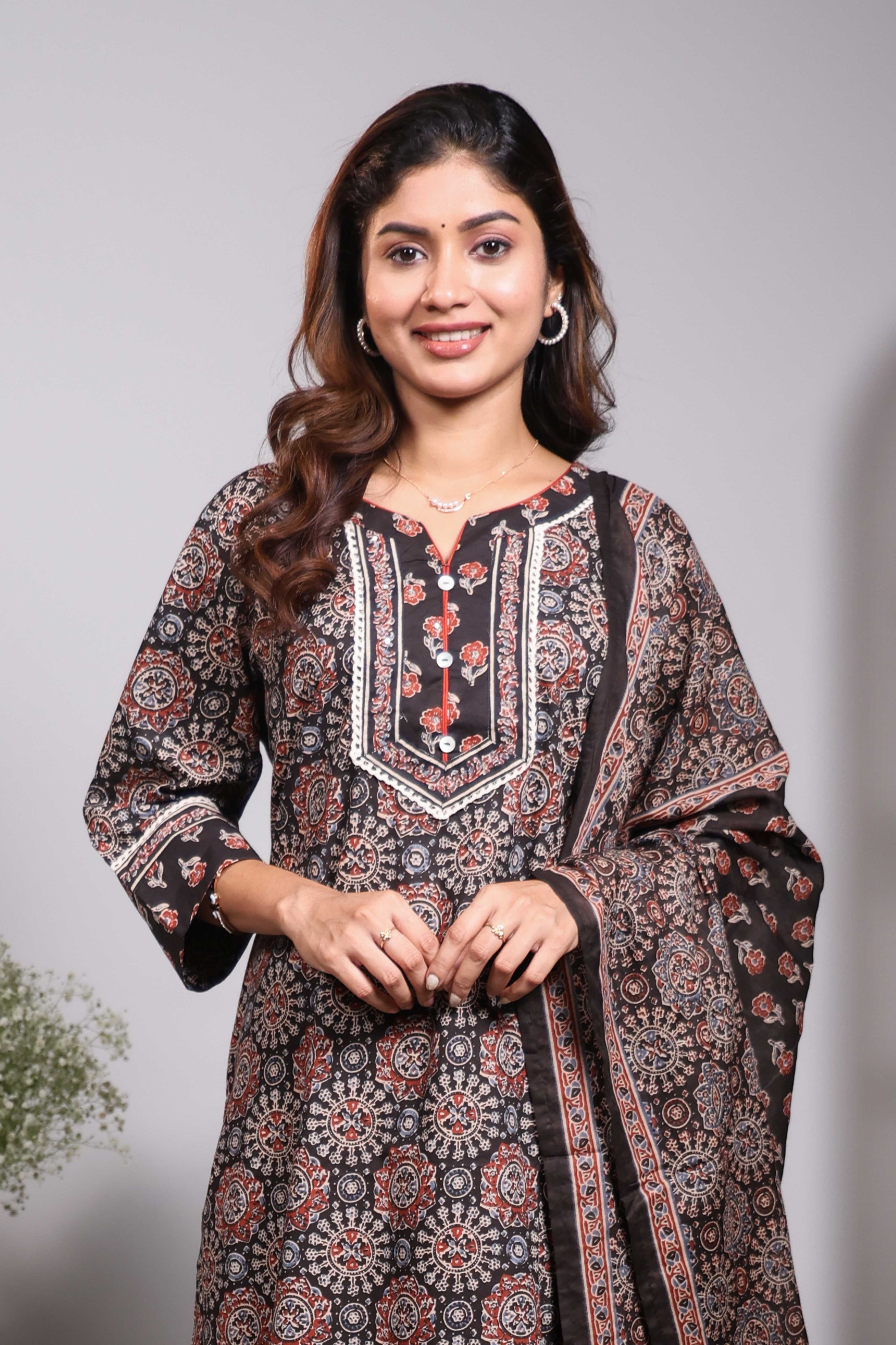 Black floral design round neck salwar set with 3/4th sleeve, self bottom and matching dupatta