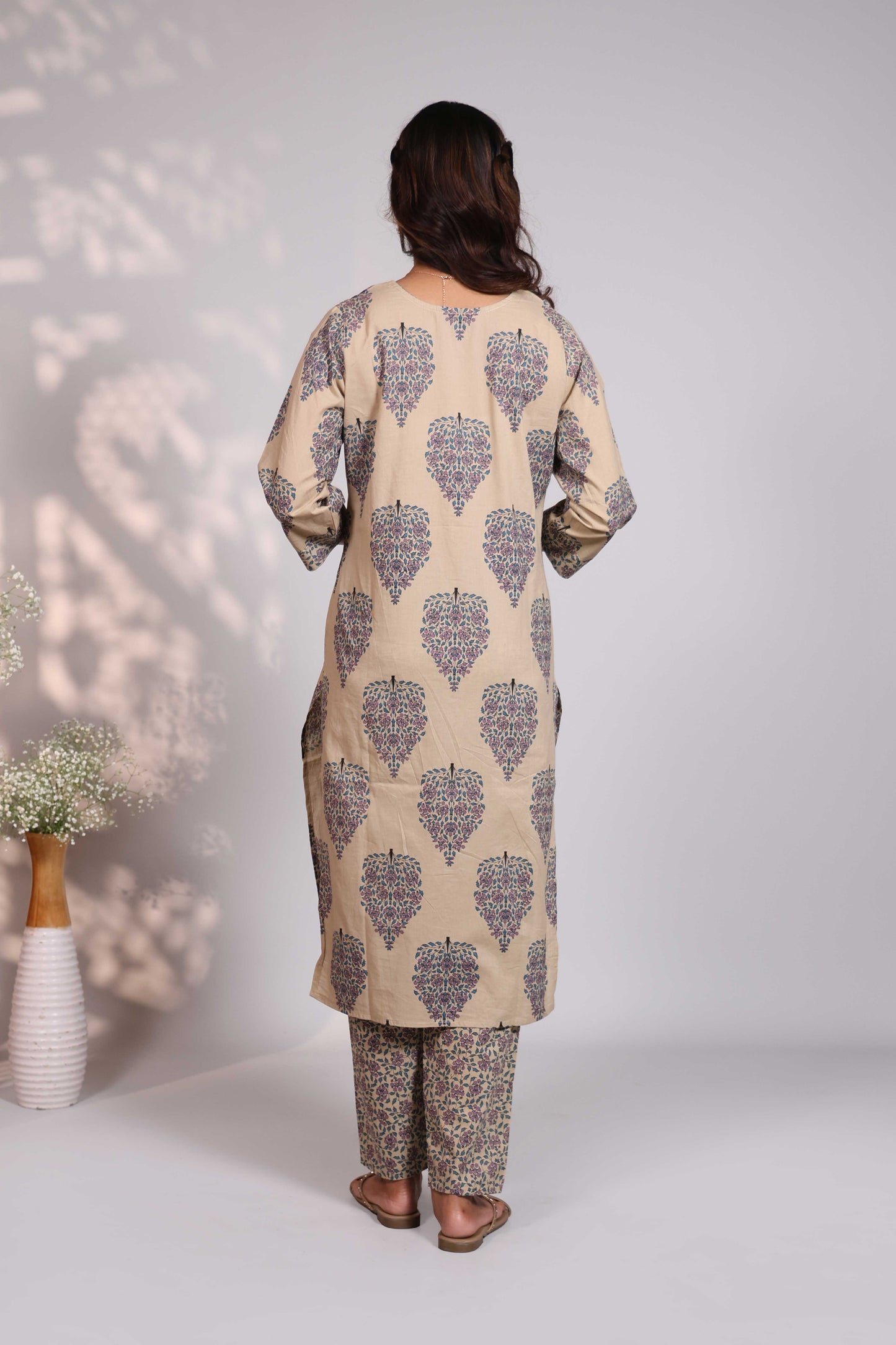 Pale brown floral design motifs V neck salwar set with 3/4th sleeve, self bottom and matching dupatta