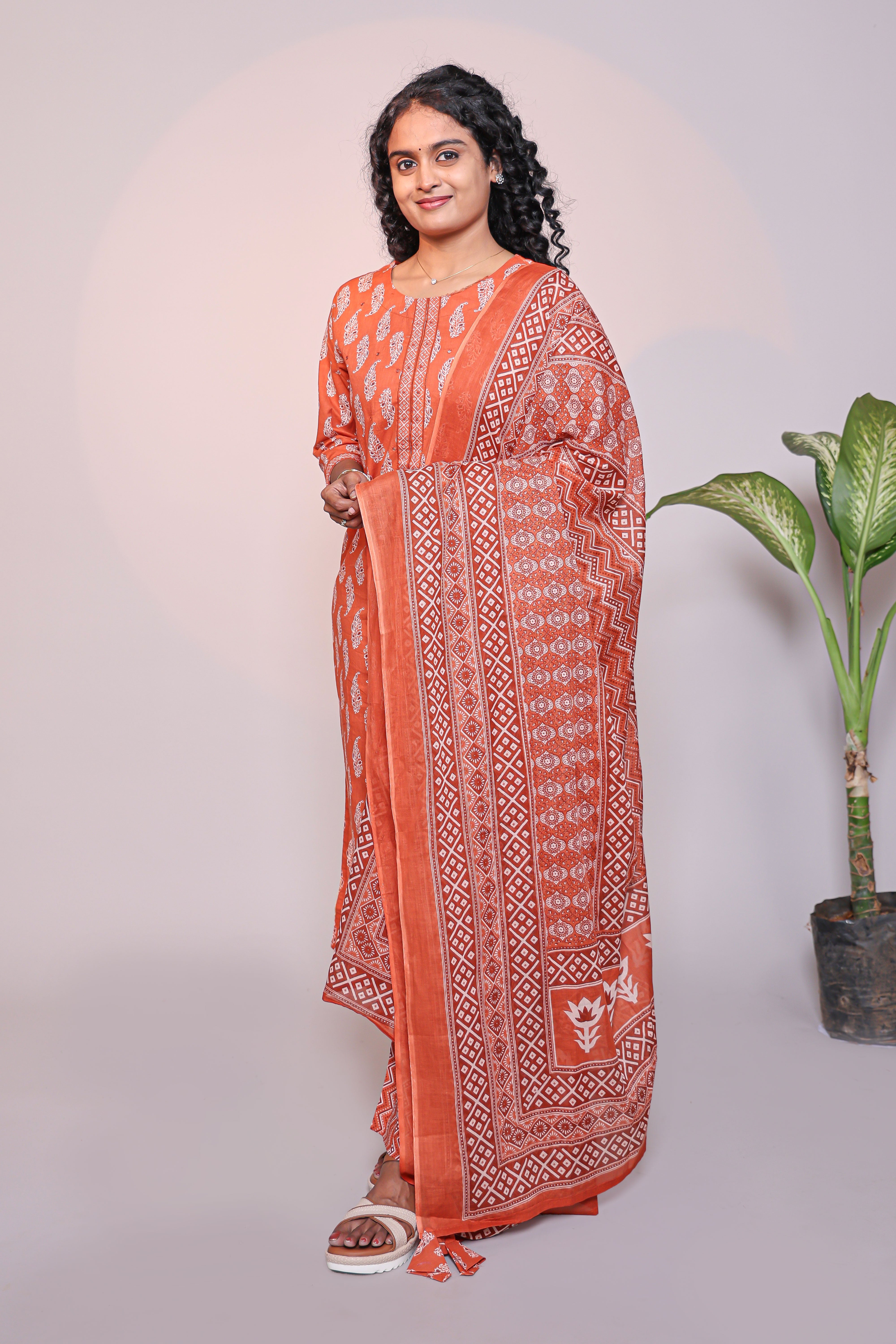 Orange motifs design 3/4 slevee salwar suit with matching pant and floral printed dupatta