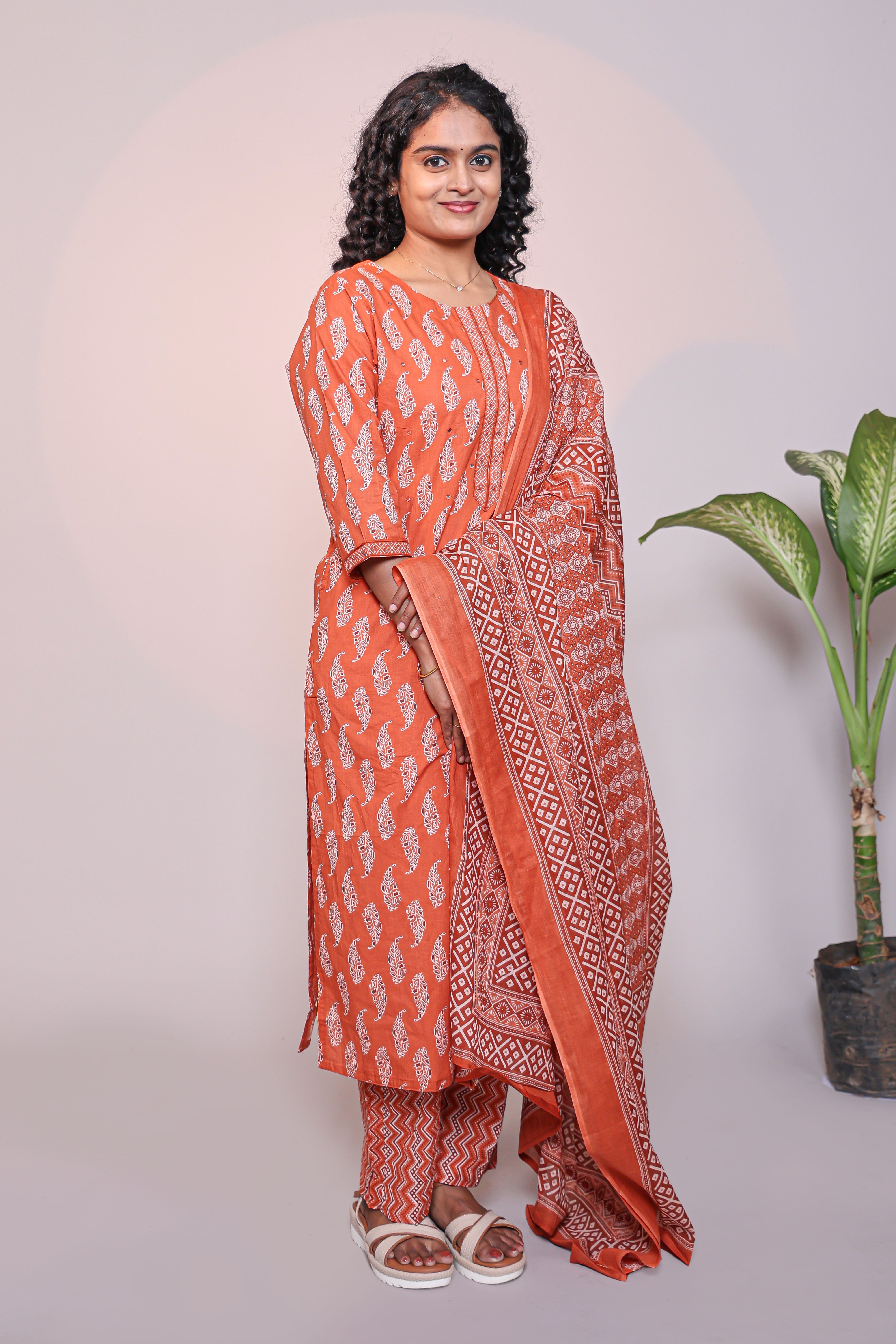 Orange motifs design 3/4 slevee salwar suit with matching pant and floral printed dupatta