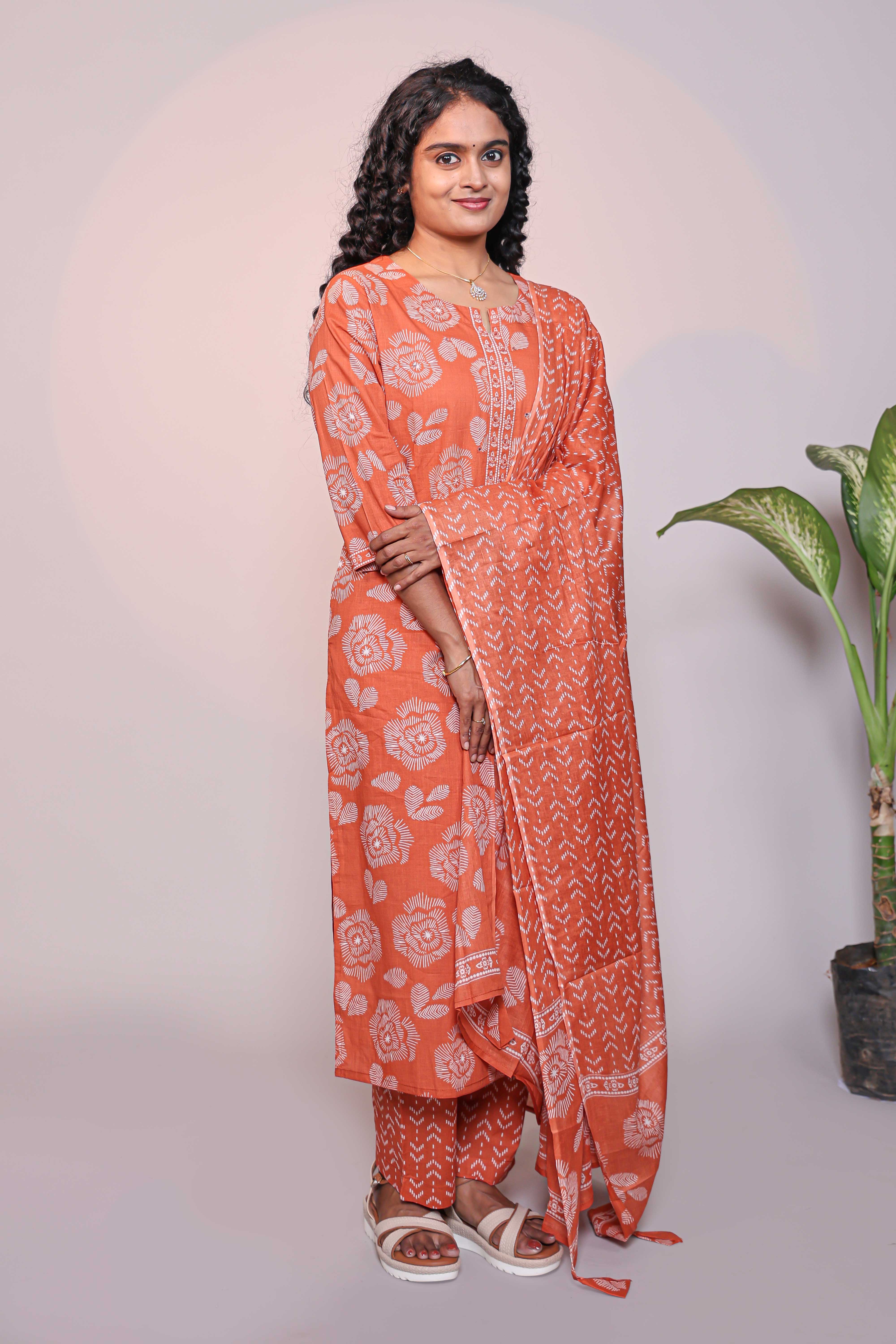 Orange floral design 3/4 slevee salwar suit with matching pant and floral printed dupatta