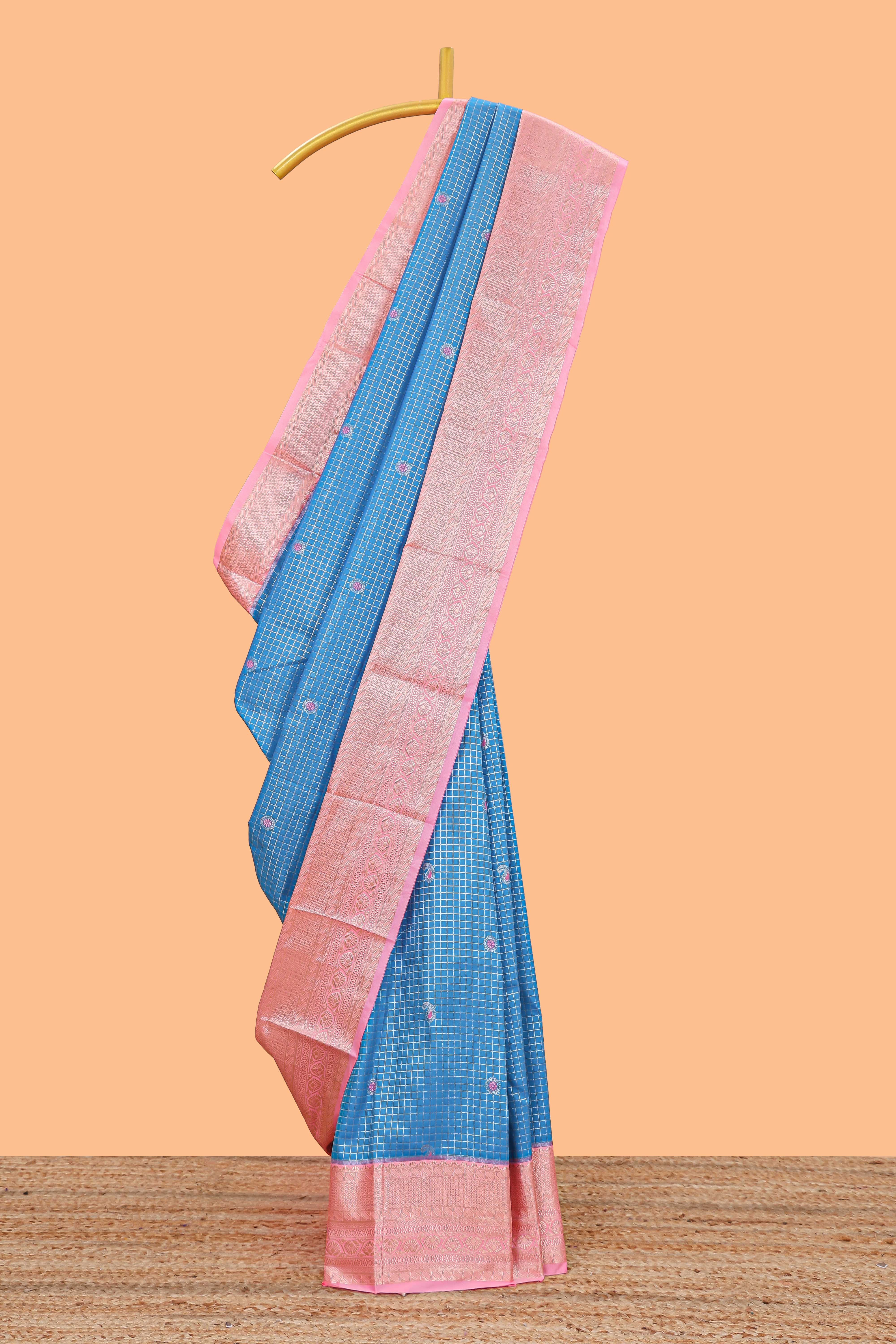 Blue checked zari butta semi soft silk saree with contrast border and floral design pallu
