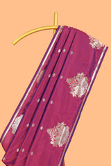 Magenta colour Semi soft silk withgold zari floral motifs border with peacock motifs and matching blouse