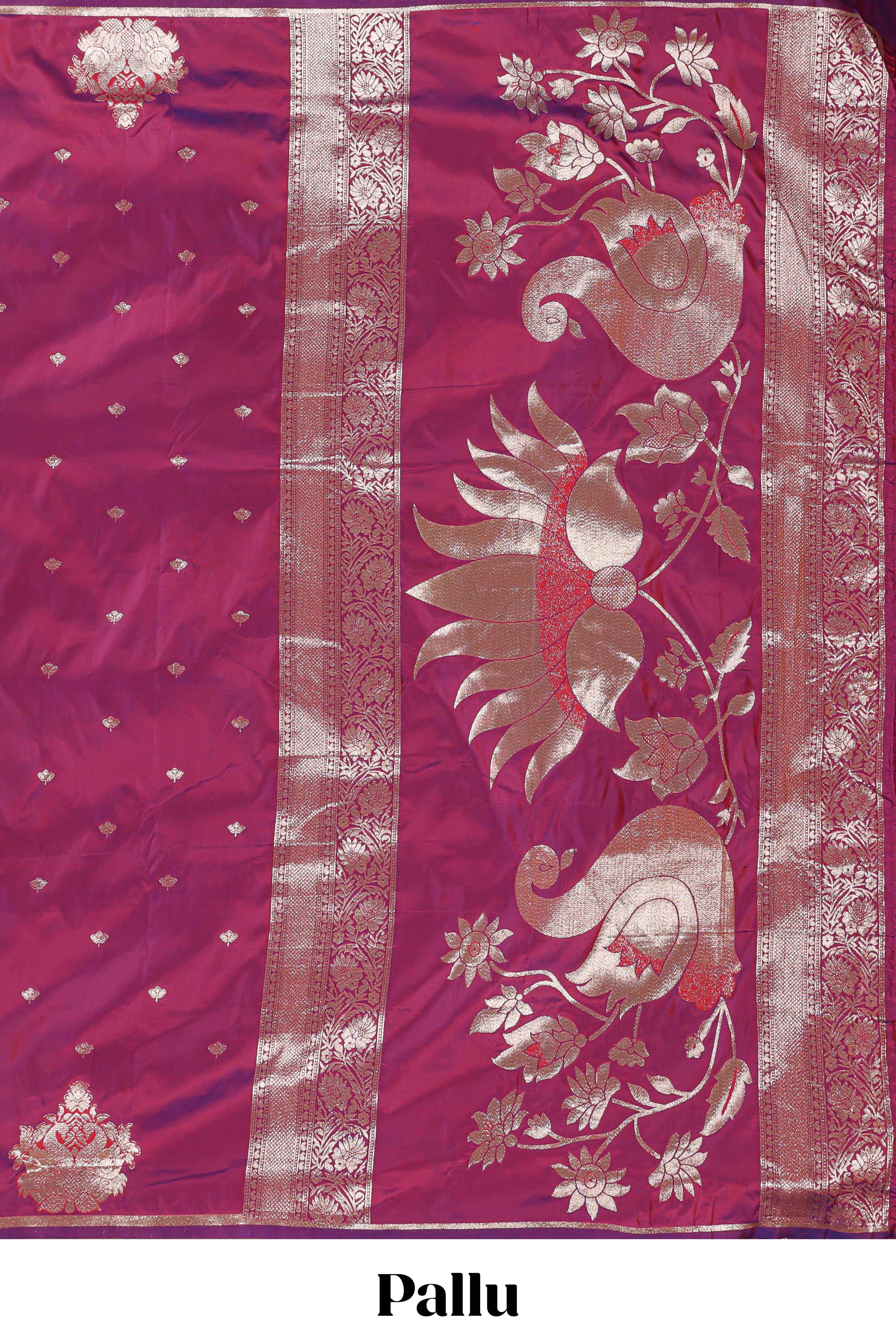 Magenta colour Semi soft silk withgold zari floral motifs border with peacock motifs and matching blouse