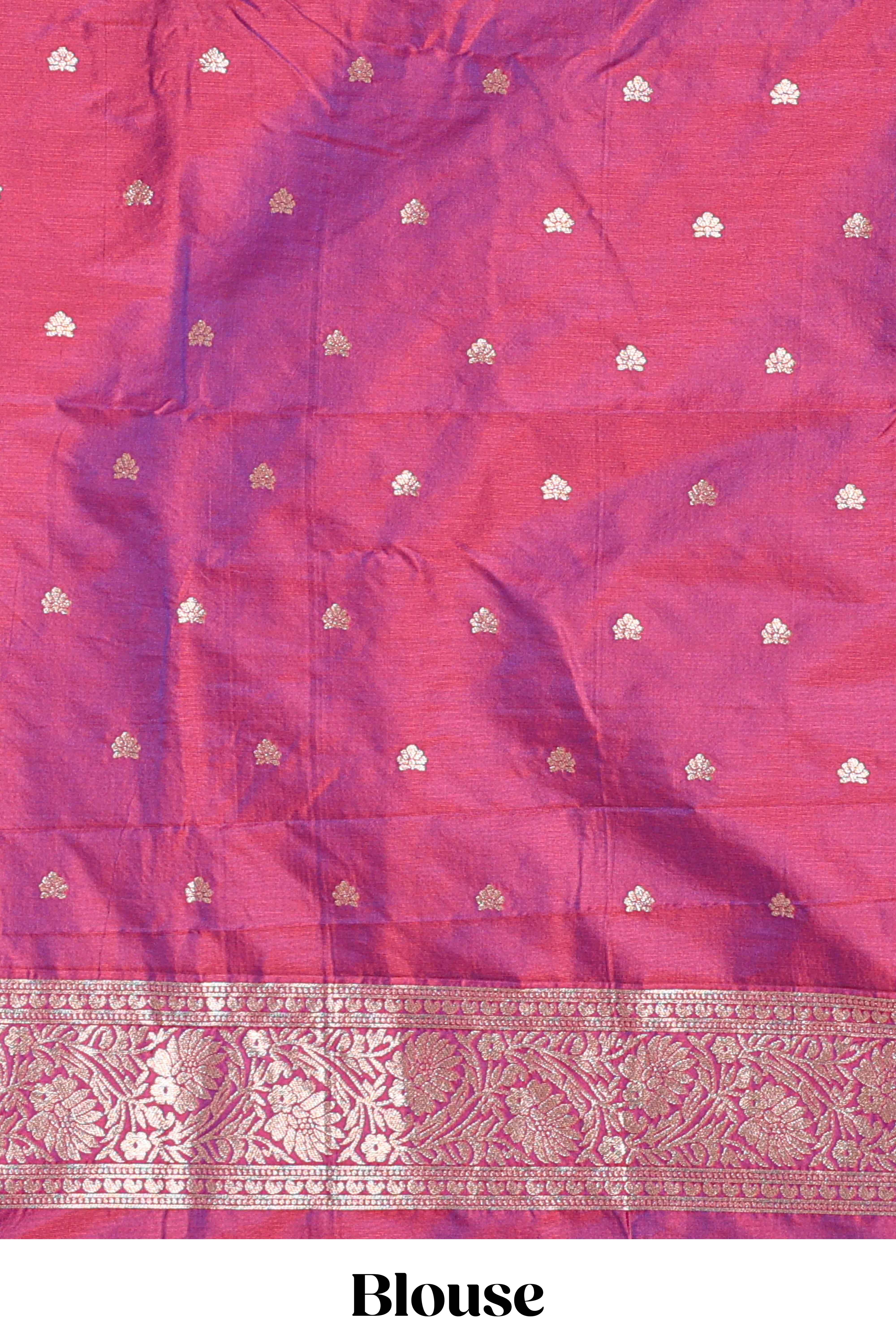 Magenta colour Semi soft silk withgold zari floral motifs border with peacock motifs and matching blouse