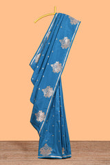 Blue colour Semi soft silk withgold zari floral motifs border with peacock motifs and matching blouse