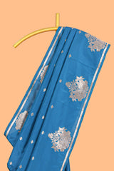 Blue colour Semi soft silk withgold zari floral motifs border with peacock motifs and matching blouse